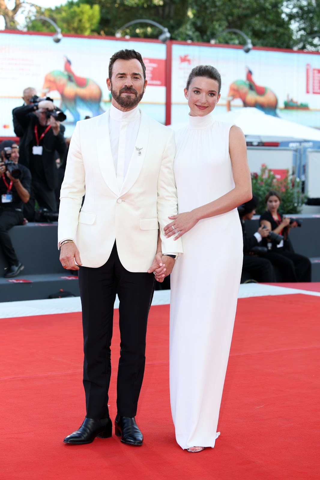 Justin Theroux and Nicole Brydon Bloom at a red carpet for "Beetlejuice Beetlejuice" during the 81st Venice International Film Festival on August 28, 2024, in Venice, Italy | Source: Getty Images