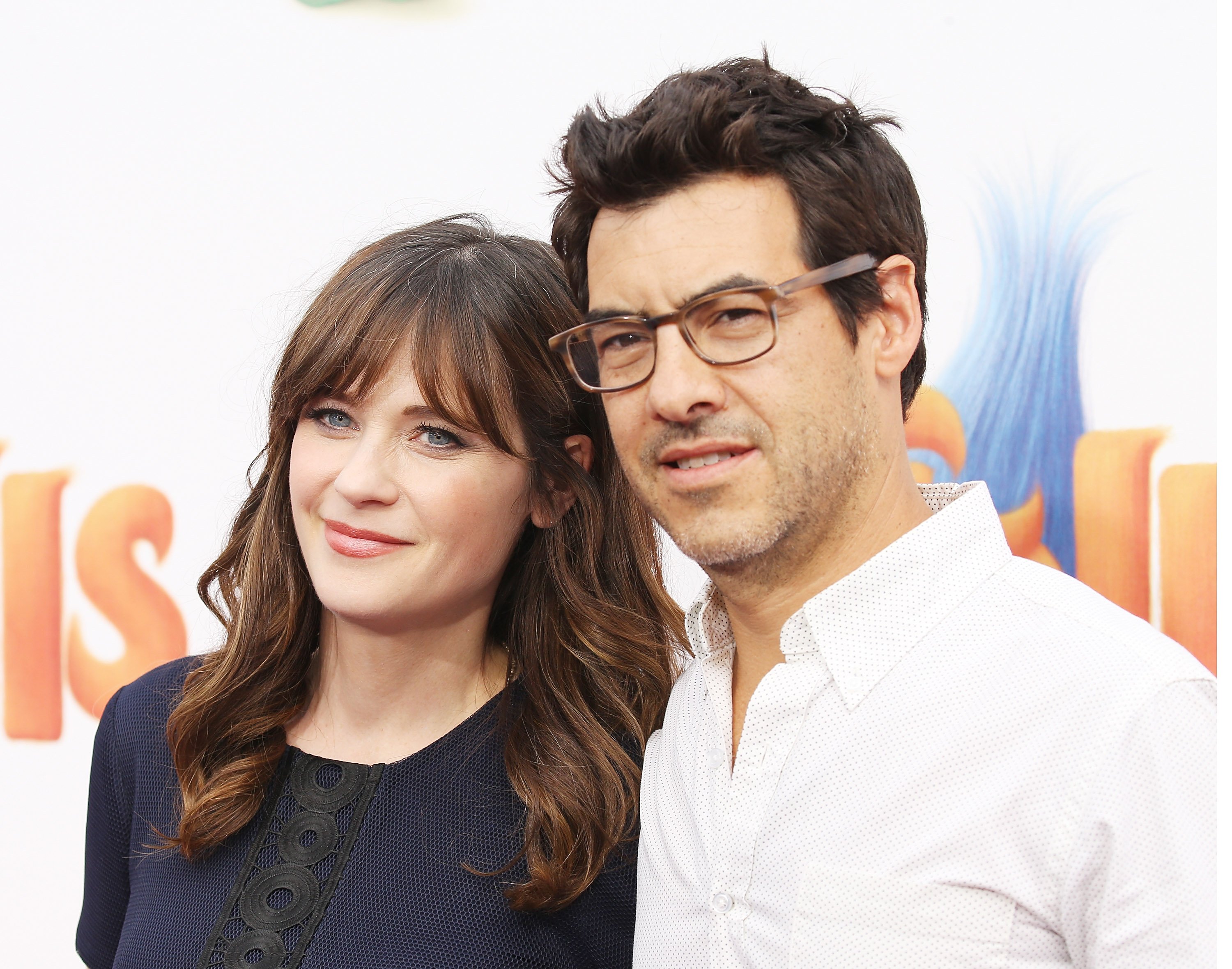 Zooey Deschanel and her then-husband, film producer Jacob Pechenik arriving at the Los Angeles premiere of 20th Century Fox's "Trolls" at Regency Village Theatre on October 23, 2016 in Westwood, California. / Source: Getty Images