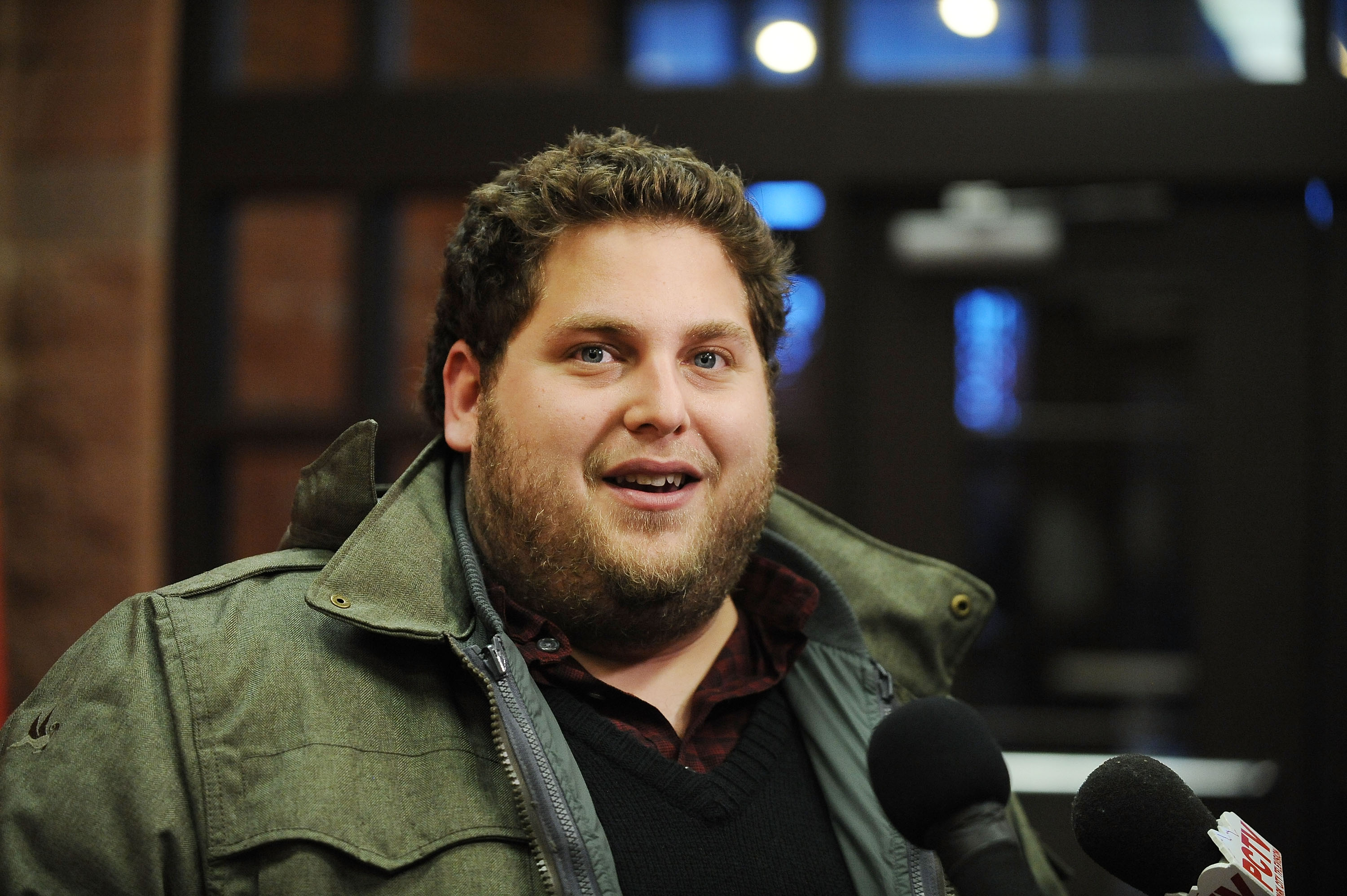 Jonah Hill appeared at the "Cyrus" premiere during the 2010 Sundance Film Festival at the Eccles Center Theatre in Park City, Utah, on January 23, 2010. Dressed for the cold in a green winter jacket layered over a dark sweater and plaid shirt, the actor sported short hair and a full beard as he spoke with reporters at the event. The appearance captured Hill during the fuller-figured years that defined much of his early public image.