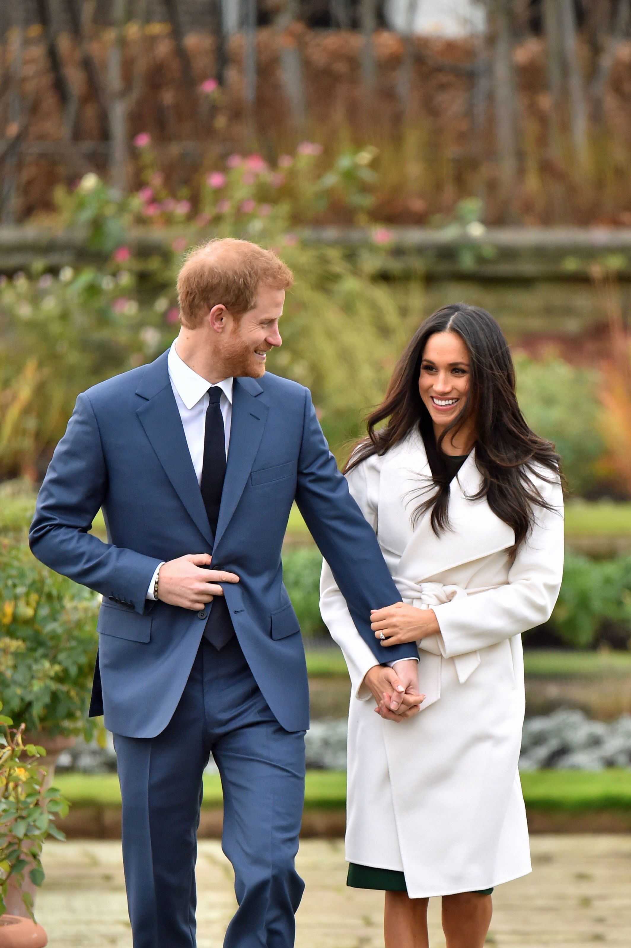 Prince Harry and Meghan Markle in the Sunken Garden at Kensington Palace, London, after the announcement of their engagement. | Source: Getty Images