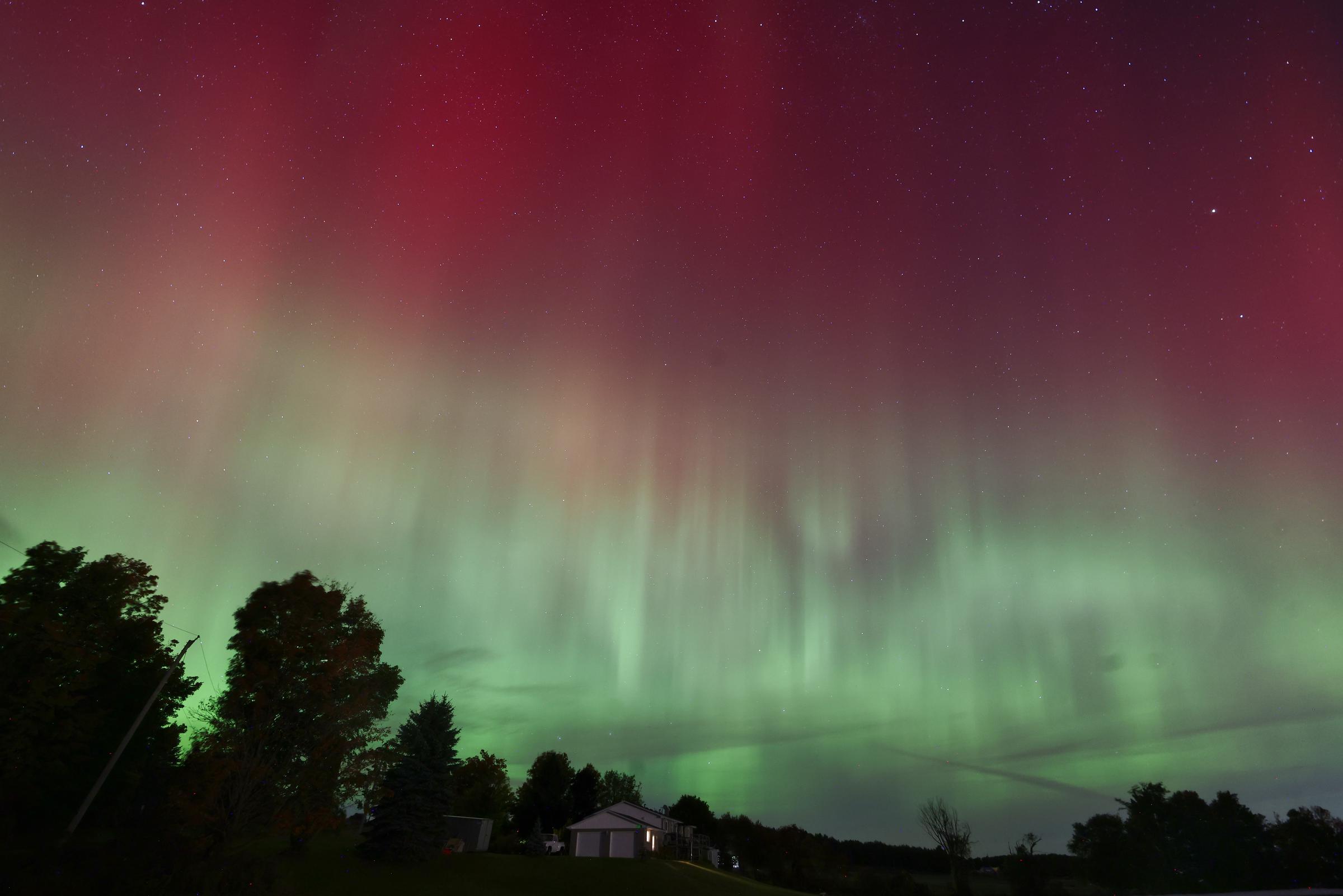 The Aurora borealis, or the northern lights, illuminates the night sky in Shelburne, Toronto, Canada on October 11, 2024 | Source: Getty Images