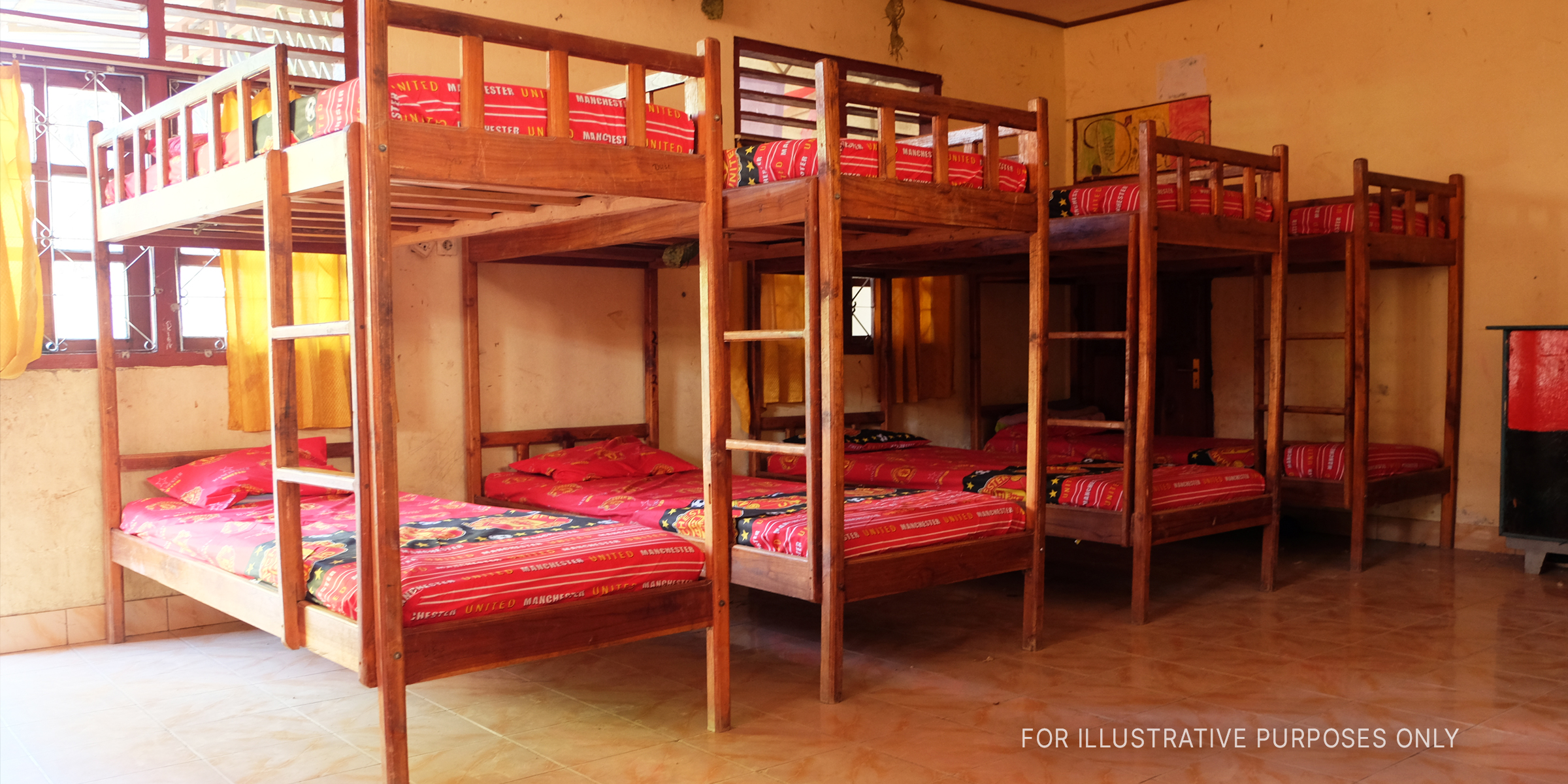 Several bunk beds in a room. | Source: Shutterstock