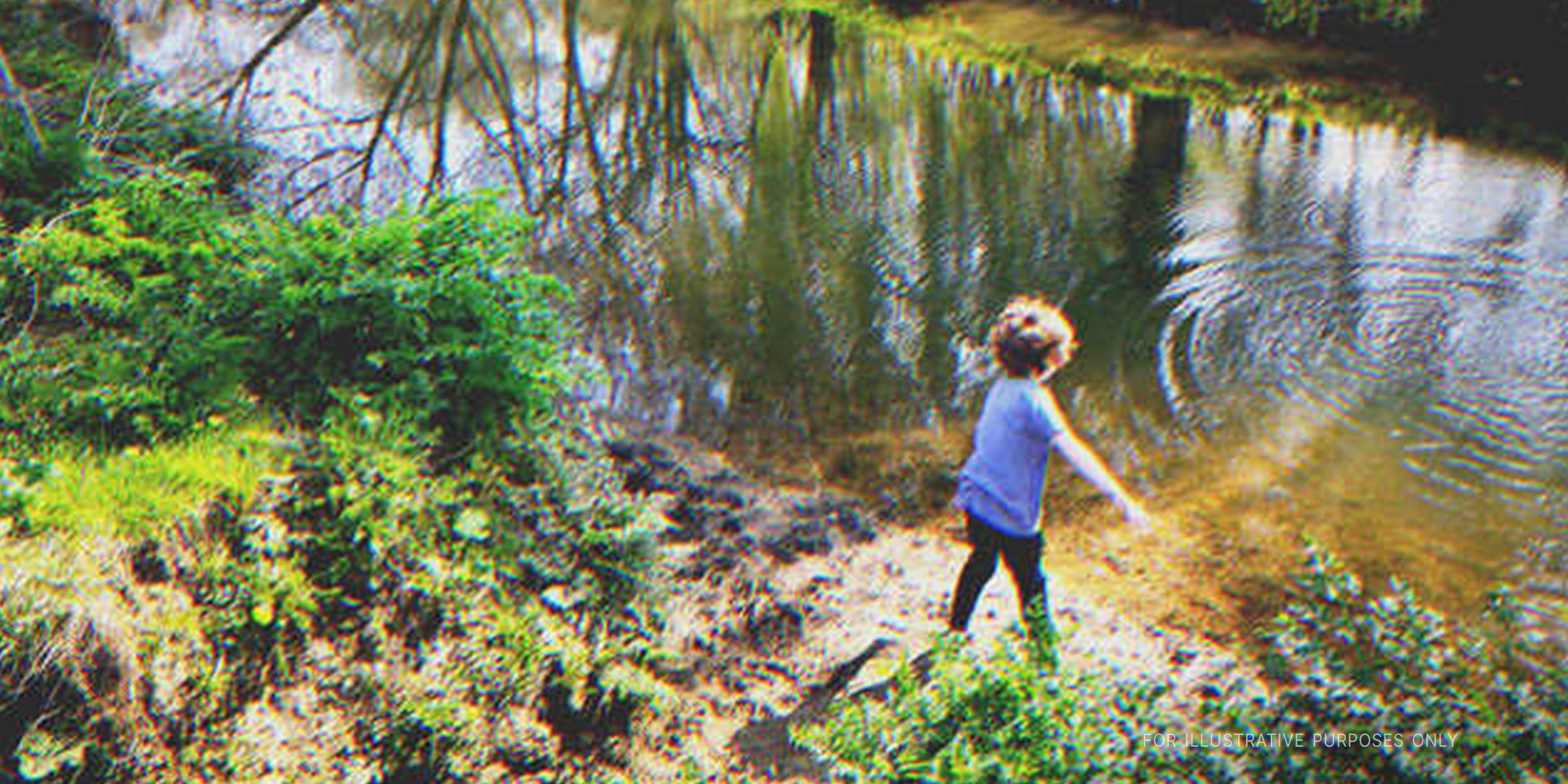 A little boy playing by a pond | Source: Shutterstock
