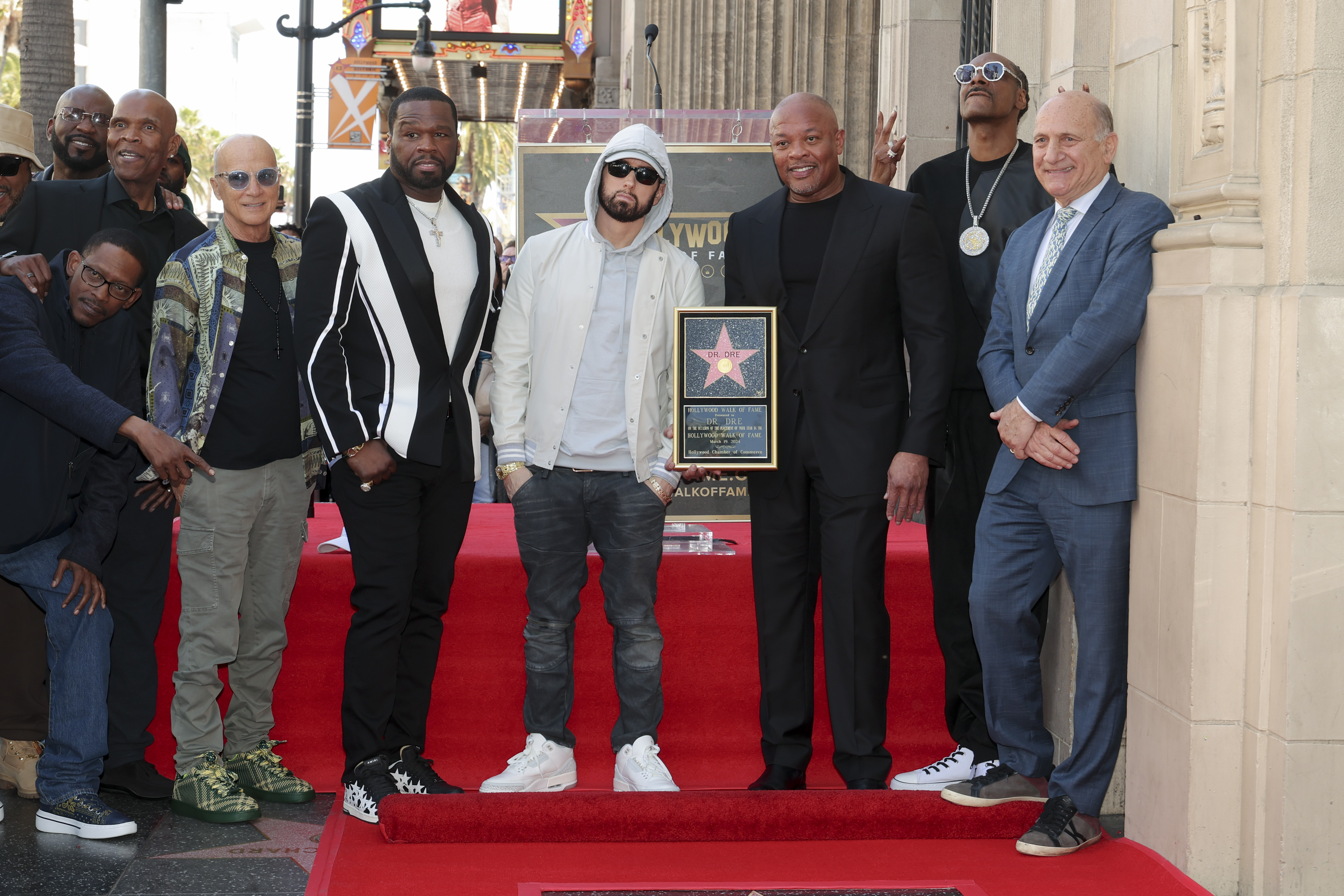 Michael "Harry-O" Harris, Kurupt, Big Boy, Jimmy Iovine, 50 Cent, Eminem, Dr. Dre, Snoop Dogg and Steve Nissen at the Hollywood Walk of Fame in 2024 | Source: Getty Images