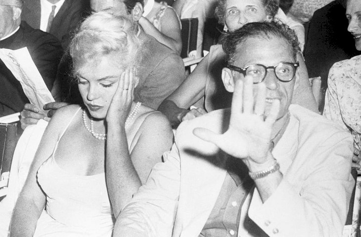 Arthur Miller shoos photographers away at the Boston Arts Center Theatre | Getty Images