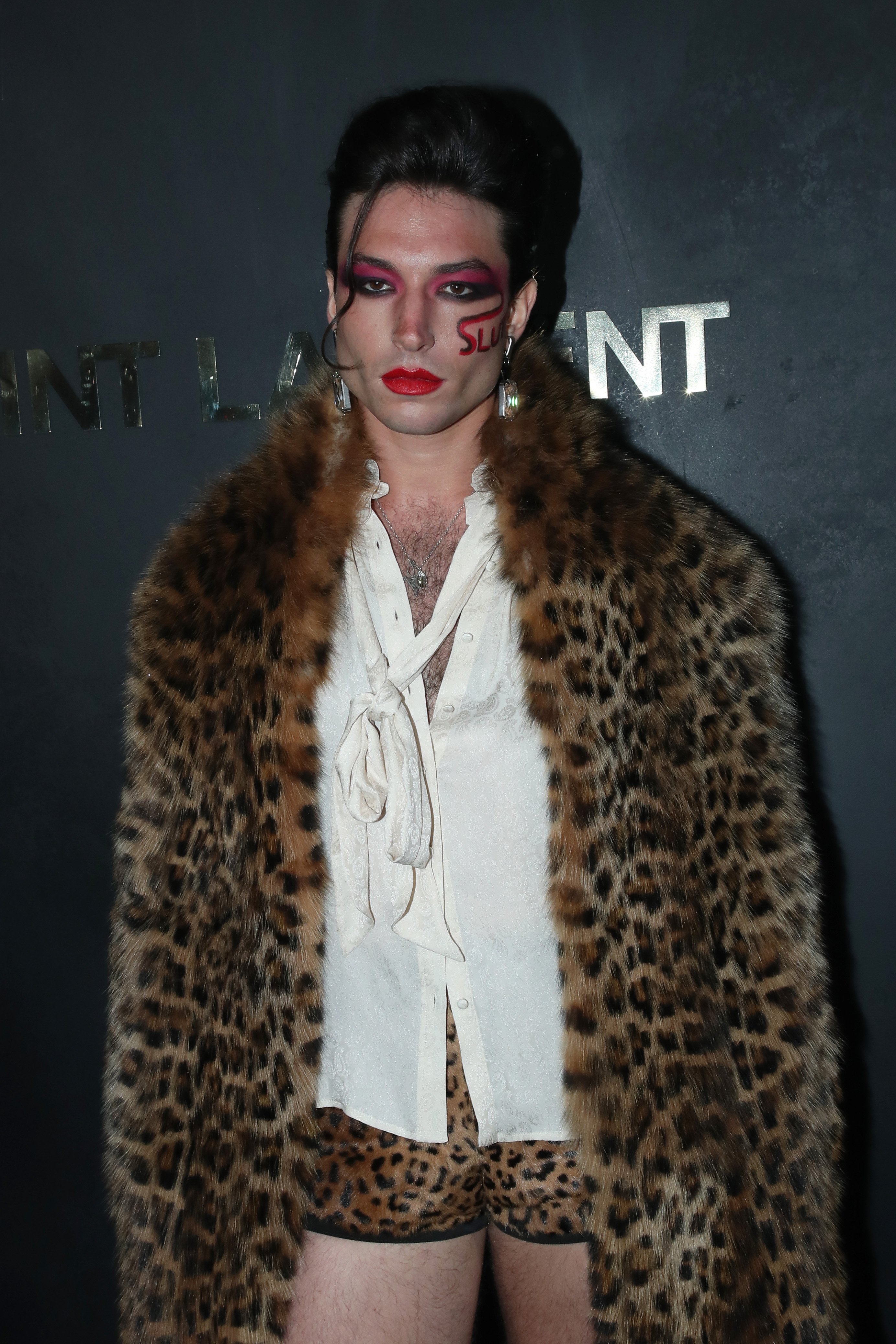 Ezra Miller poses at the Saint Laurent Womenswear Spring/Summer 2020 show as part of Paris Fashion Week on September 24, 2019, in Paris, France | Source: Getty Images