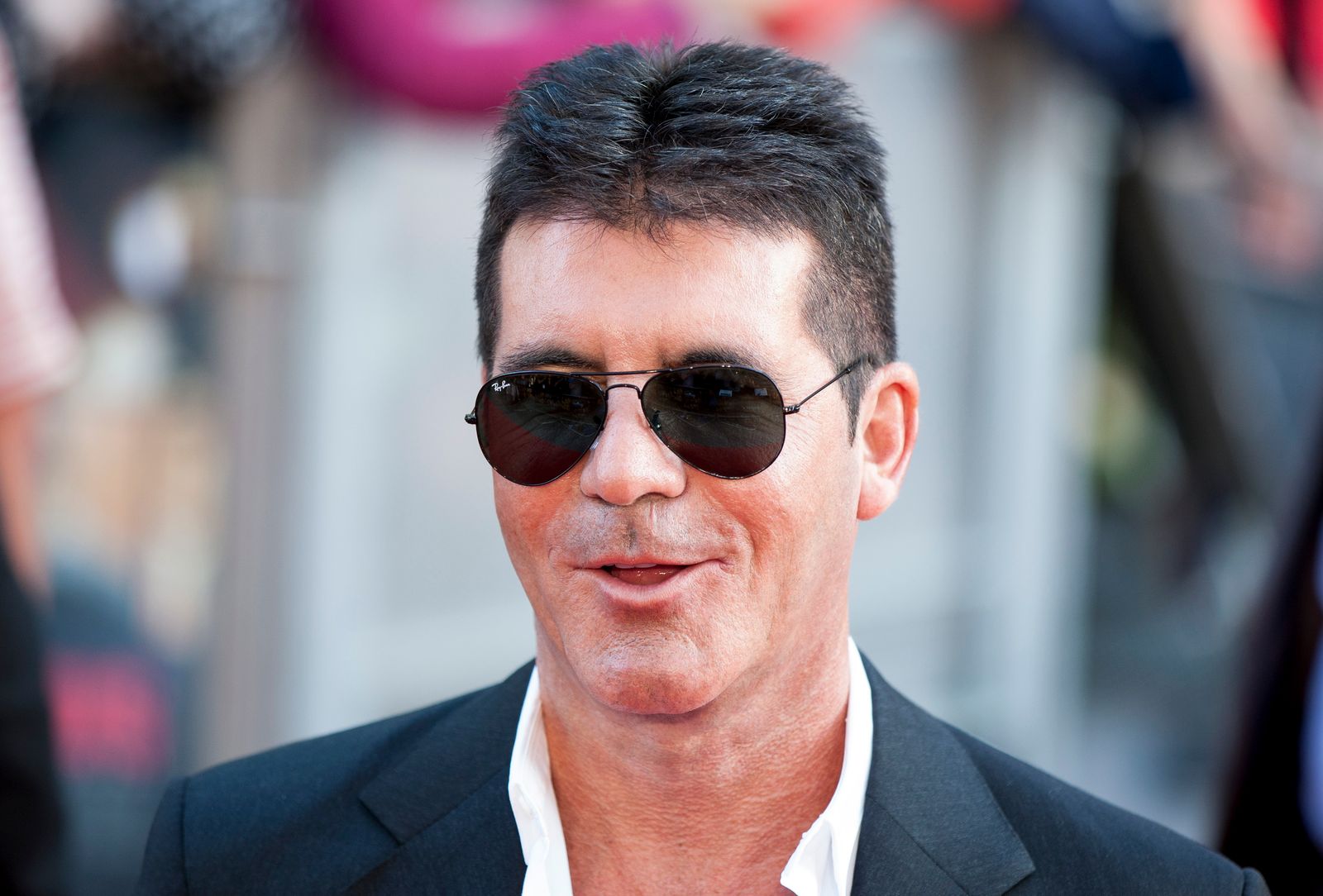 Entertainment producer Simon Cowell attend the 2013 world premiere of "One Direction" in London. | Photo: Getty Images