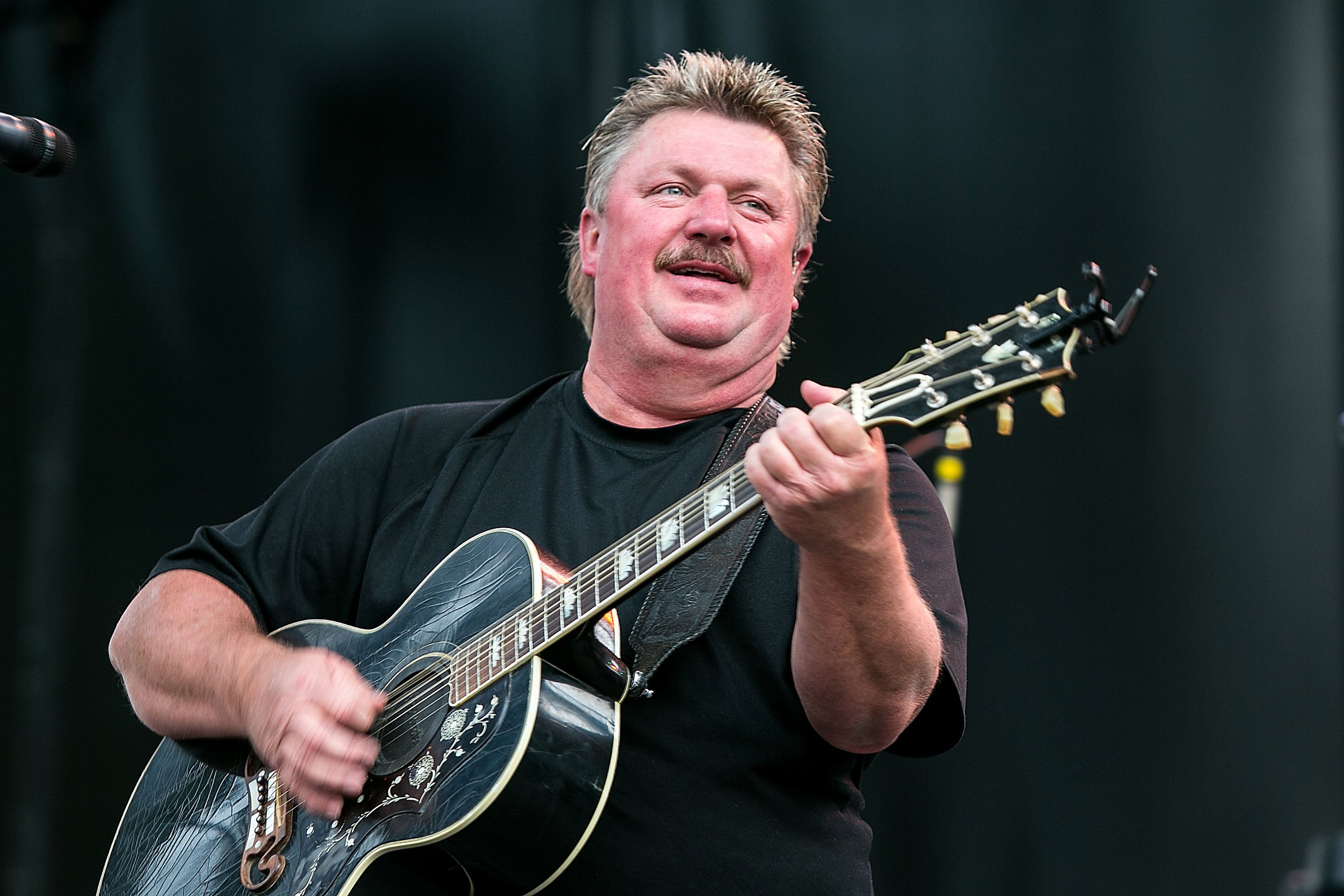 Joe Diffie performs on stage at the Watershed Music Festival 2014 on August 2, 2014, in George, Washington. | Source: Getty Images.