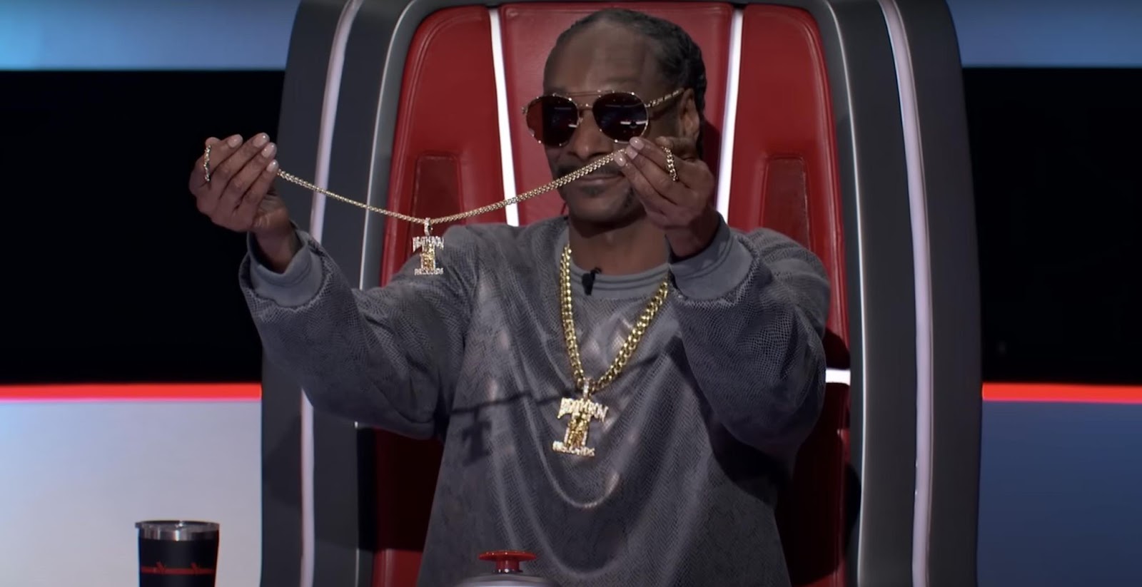 Snoop Dogg holding up the Death Row Records chain on season 26 of "The Voice." | Source: YouTube/The Voice