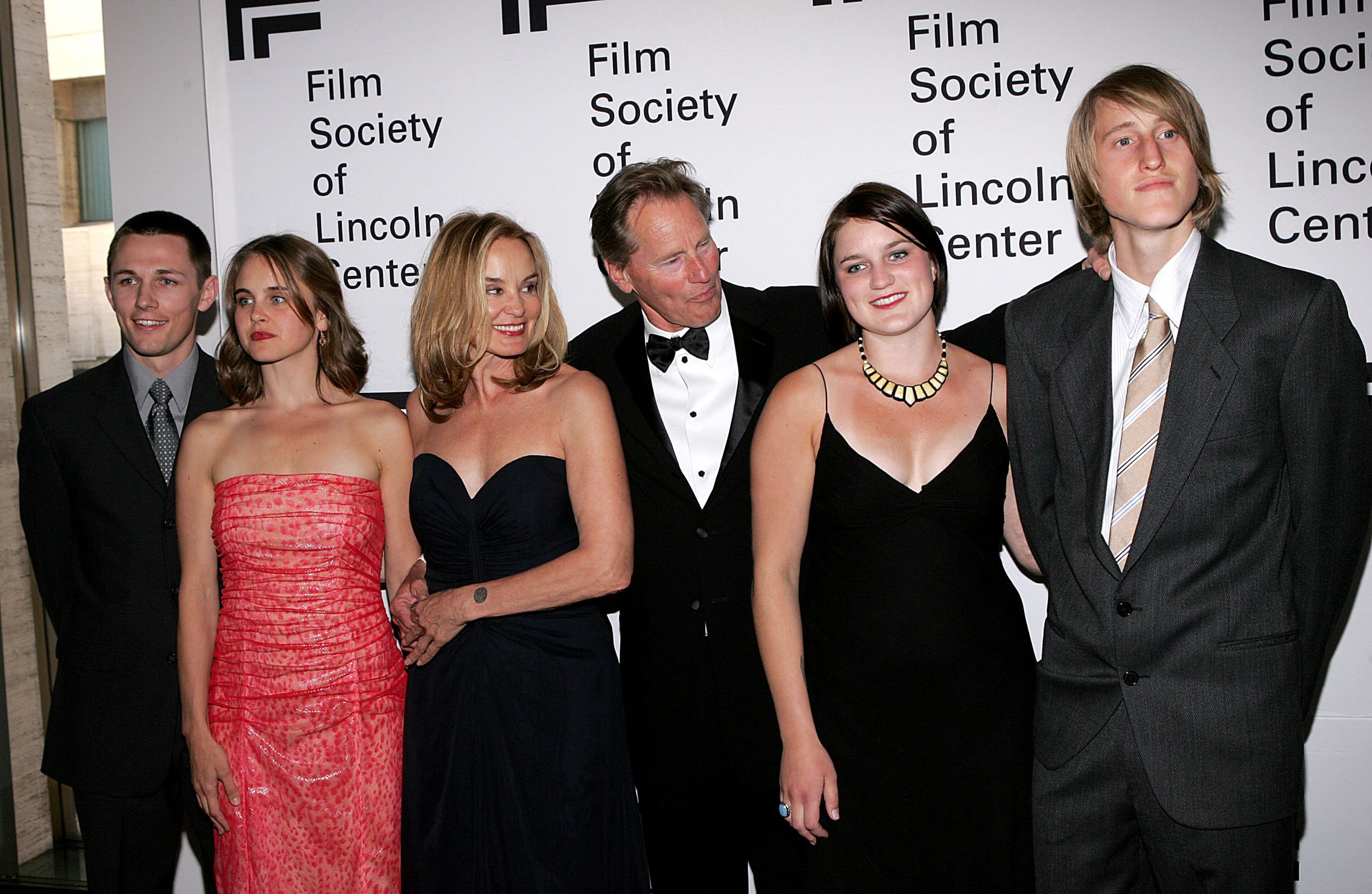 Actor Sam Shepard and actress Jessica Lange (C) pose with family members Shura Baryshnikov (2nd L), her husband Bruce Bryan (L), Hanna Shepard and Walker Shepard (R) attend a cermony honoring Lang at the Film Society of Lincoln Center at Avery Fisher Hall April 17, 2006 in New York City. | Source: Getty Images