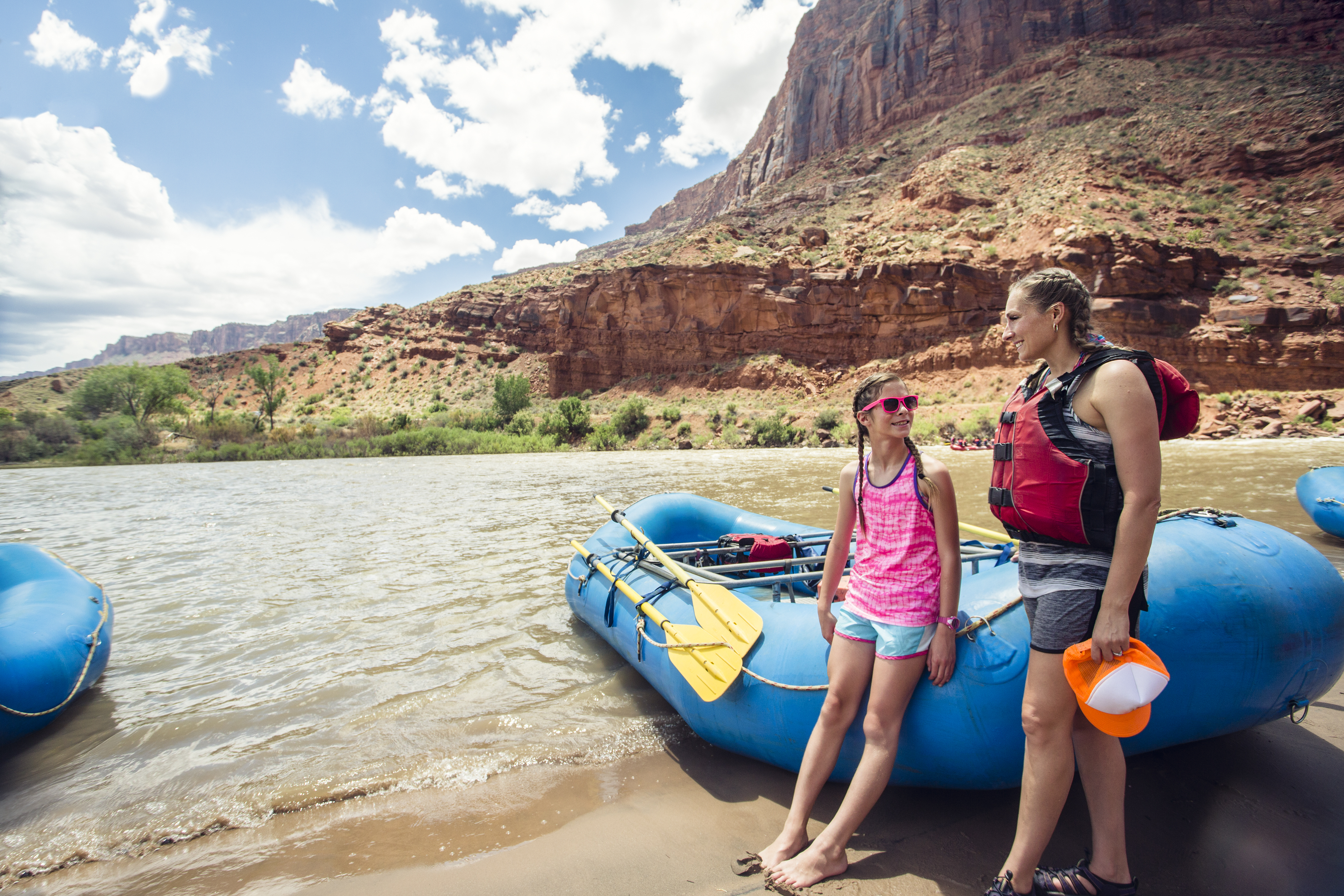 A woman and a young girl standing near the Colorado River | Source: Shutterstock