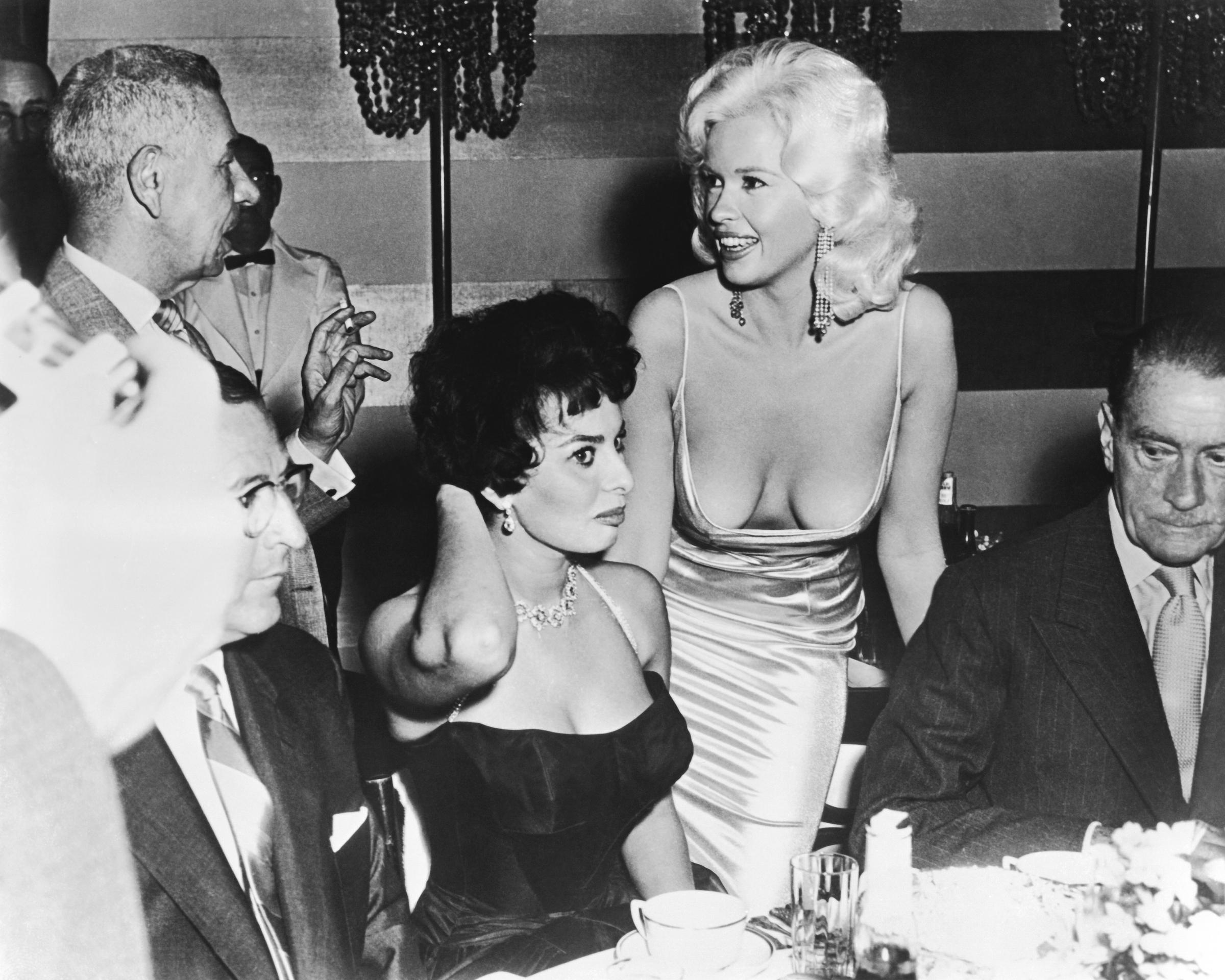 Sophia Loren and Jayne Mansfield at a promotional party for Sophia Loren in Los Angeles, California on April 12, 1957 | Source: Getty Images