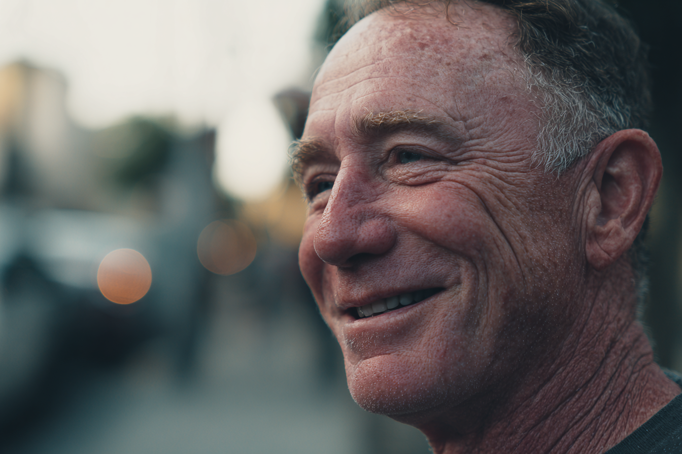 A man standing in a neighborhood | Source: Midjourney