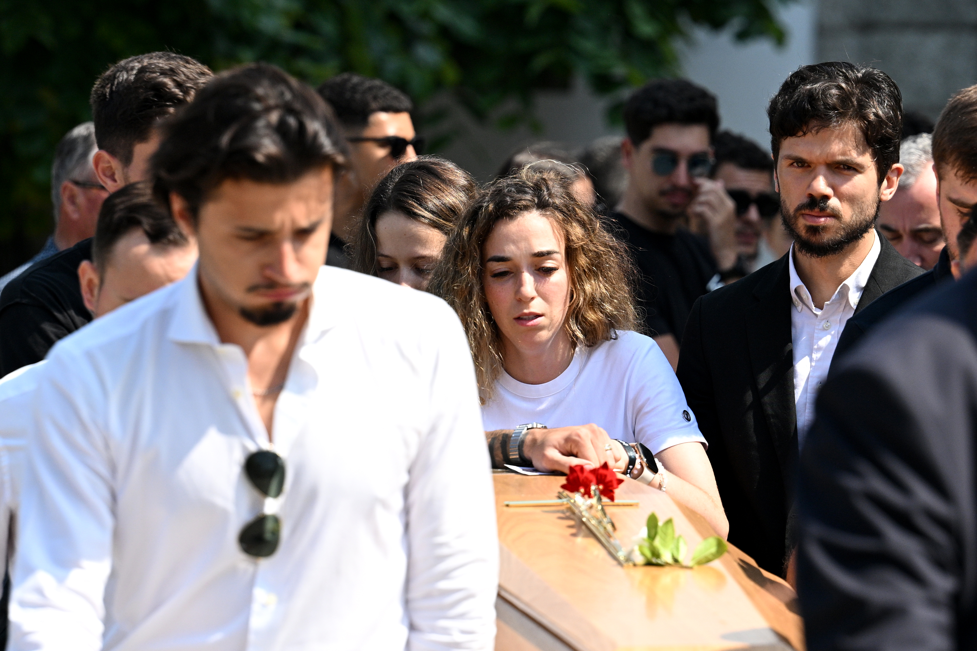 Rute Cardoso, the wife of Diogo Jota, helps carry her husband's coffin alongside mourners after a funeral service at Igreja Matriz de Gondomar on July 5, 2025 | Source: Getty Images