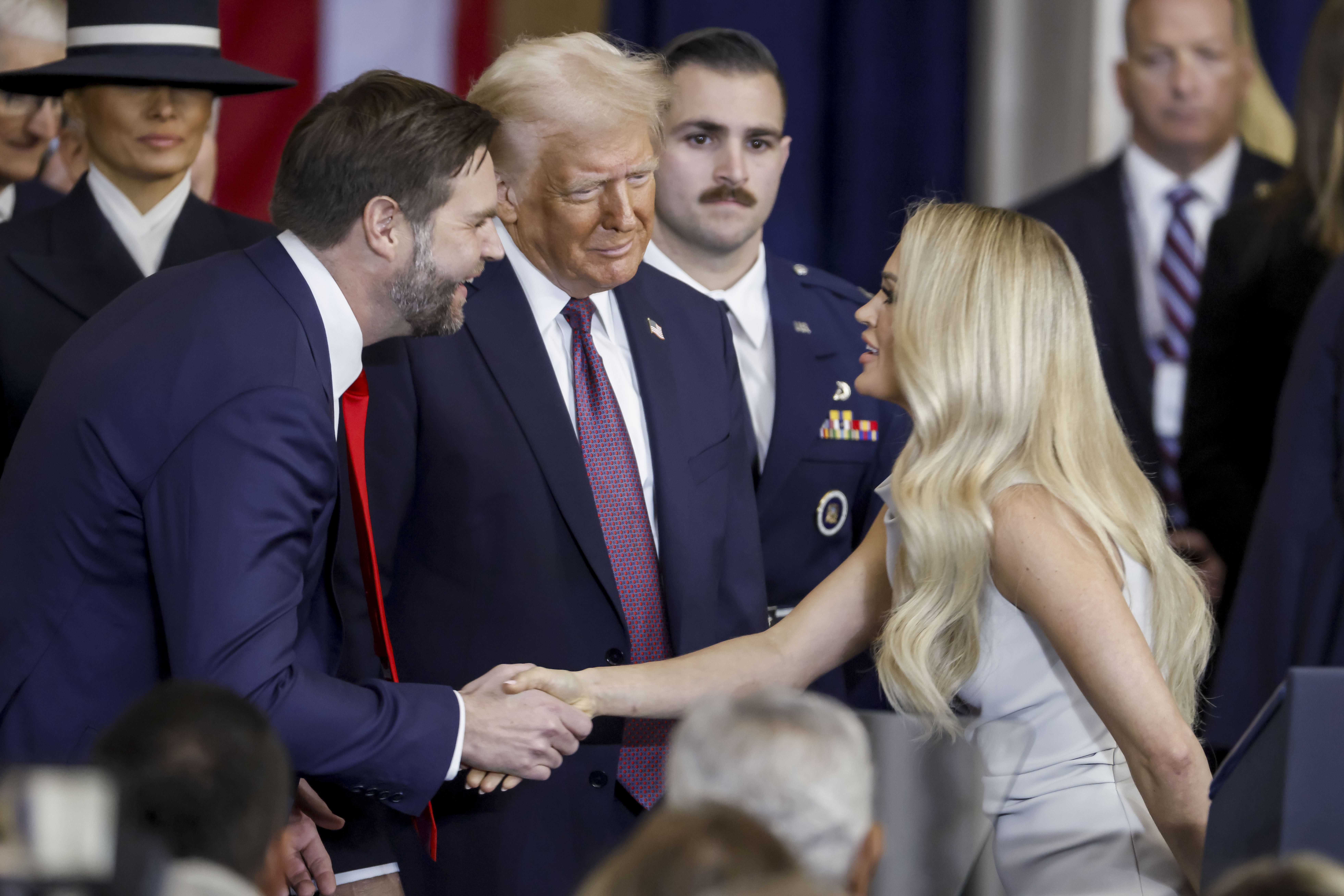 Carrie Underwood with JD Vance and Donald Trump after performing "America the Beautiful" during their inauguration ceremony in the rotunda of the United States Capitol in Washington, DC, on January 20, 2025 | Source: Getty Images