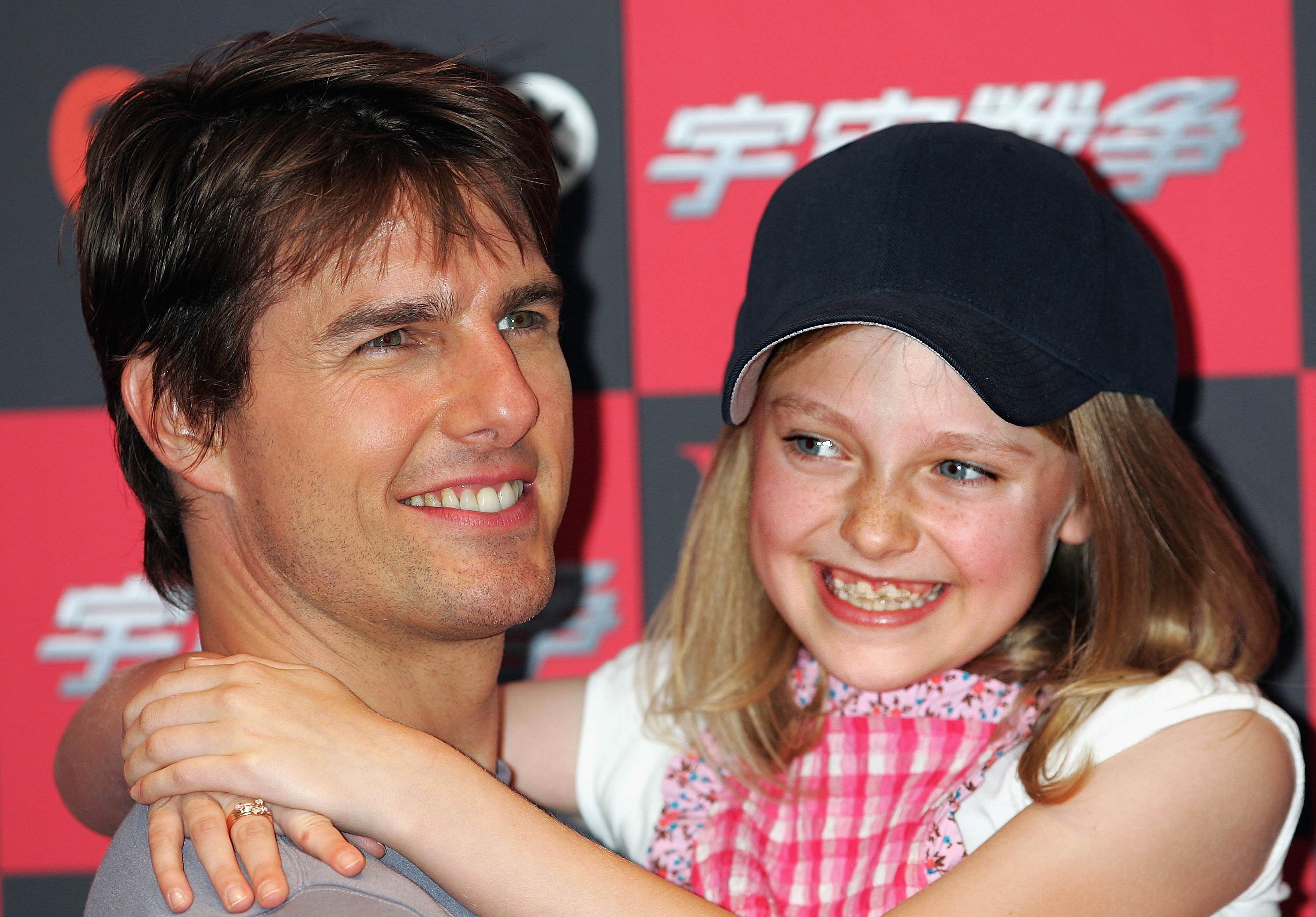 Tom Cruise and Dakota Fanning attend a photo call to promote "War of the Worlds" on June 13, 2005 in Tokyo, Japan | Source: Getty Images