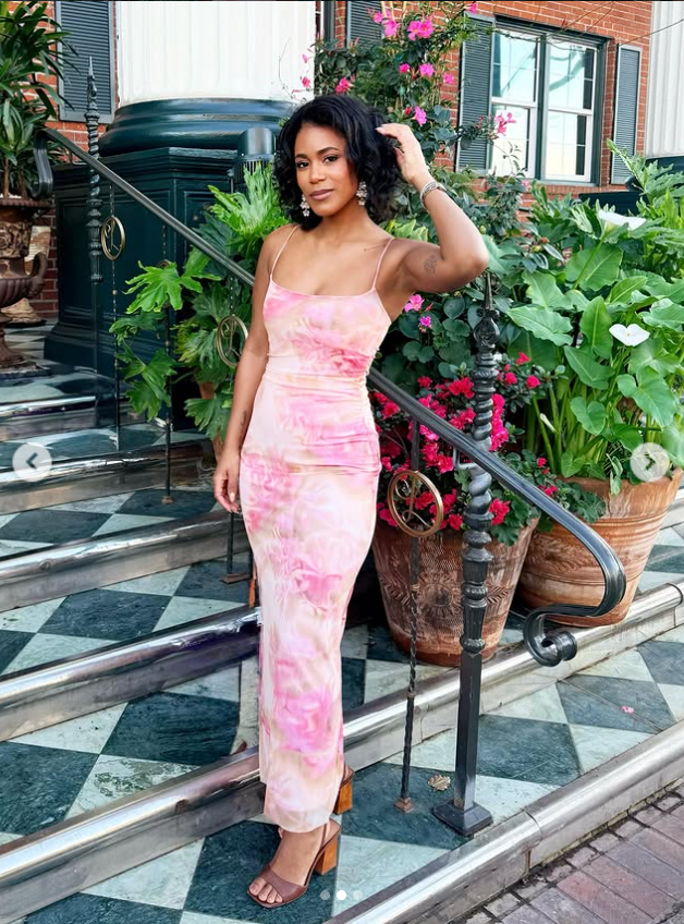 Marissa George poses outside a stylish Savannah setting in a pink floral dress in a photo shared on February 17, 2026. | Source: Instagram/rissa.george