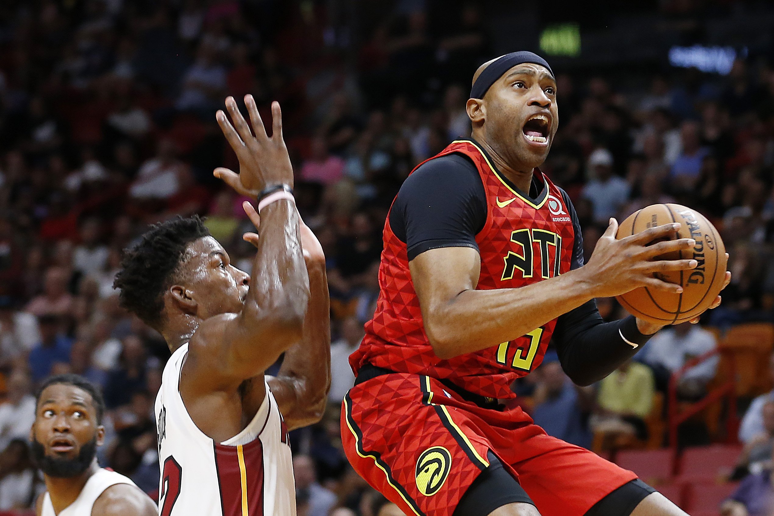 Vince Carter #15 of the Atlanta Hawks attempts a layup against Jimmy Butler #22 of the Miami Heat during the first half at American Airlines Arena on October 29, 2019 in Miami, Florida. | Source: Getty Images