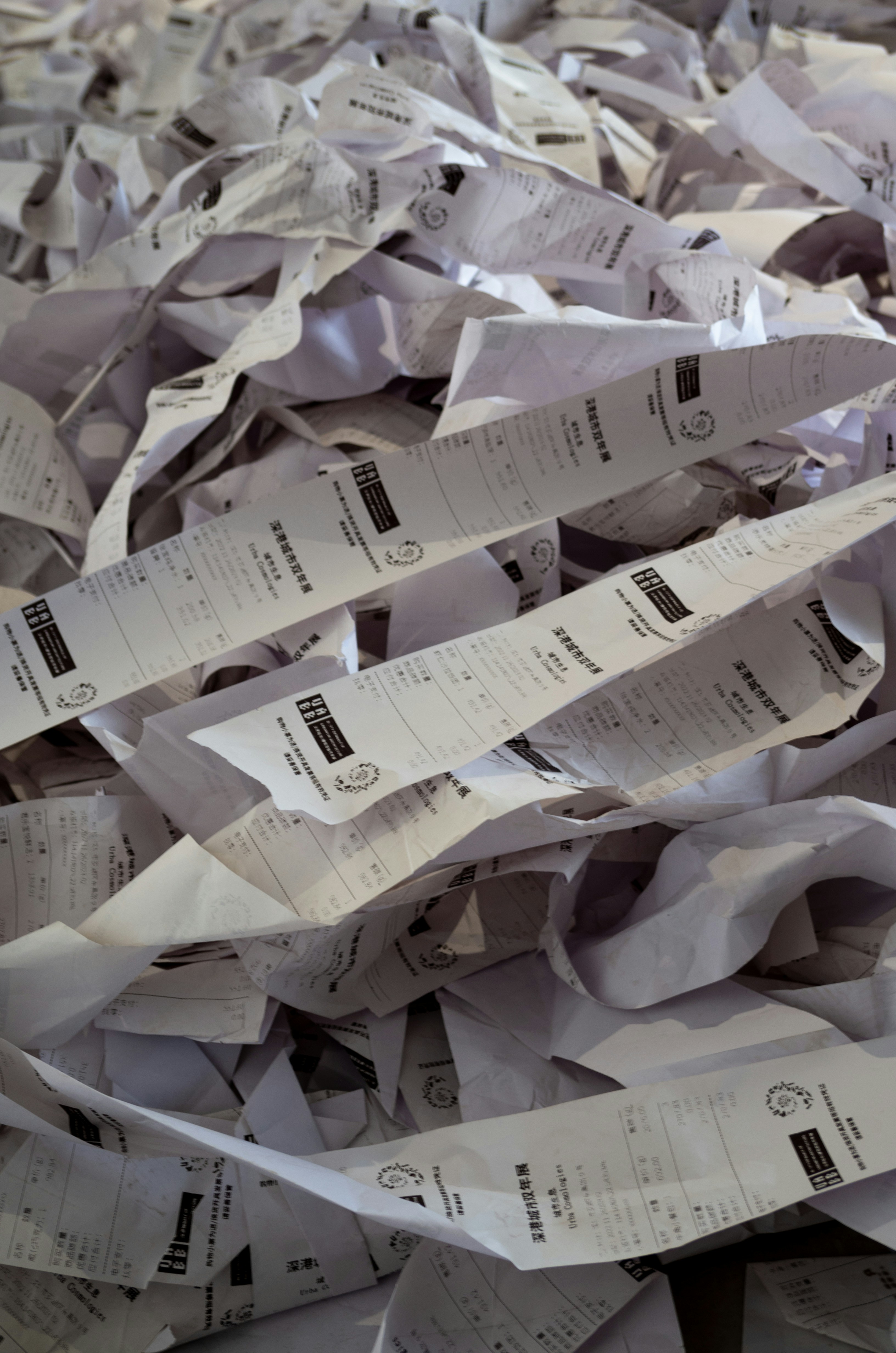 Crumpled receipts on a table | Source: Unsplash