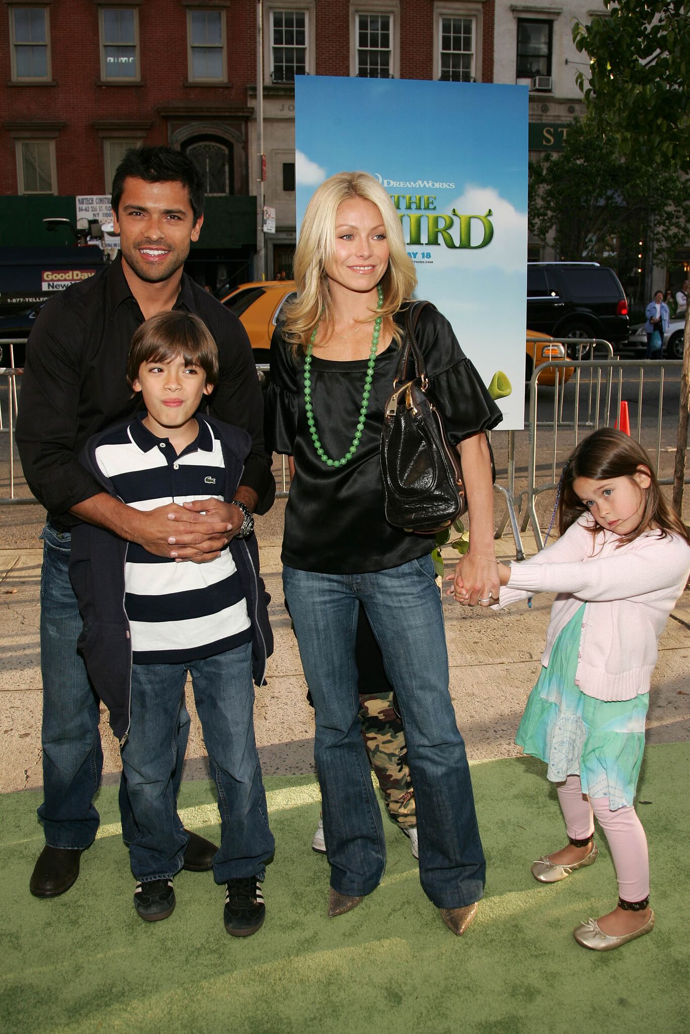 Mark Consuelos and Kelly Ripa pose with their children Michael Joseph and Lola Grace at the premiere of Shrek The Third | Getty Images