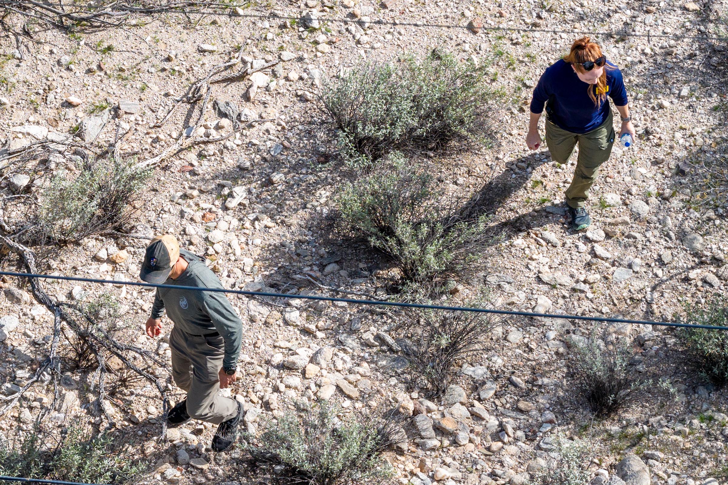 Members of the FBI surveil an area around Nancy Guthrie's residence on February 11, 2026 | Source: Getty Images