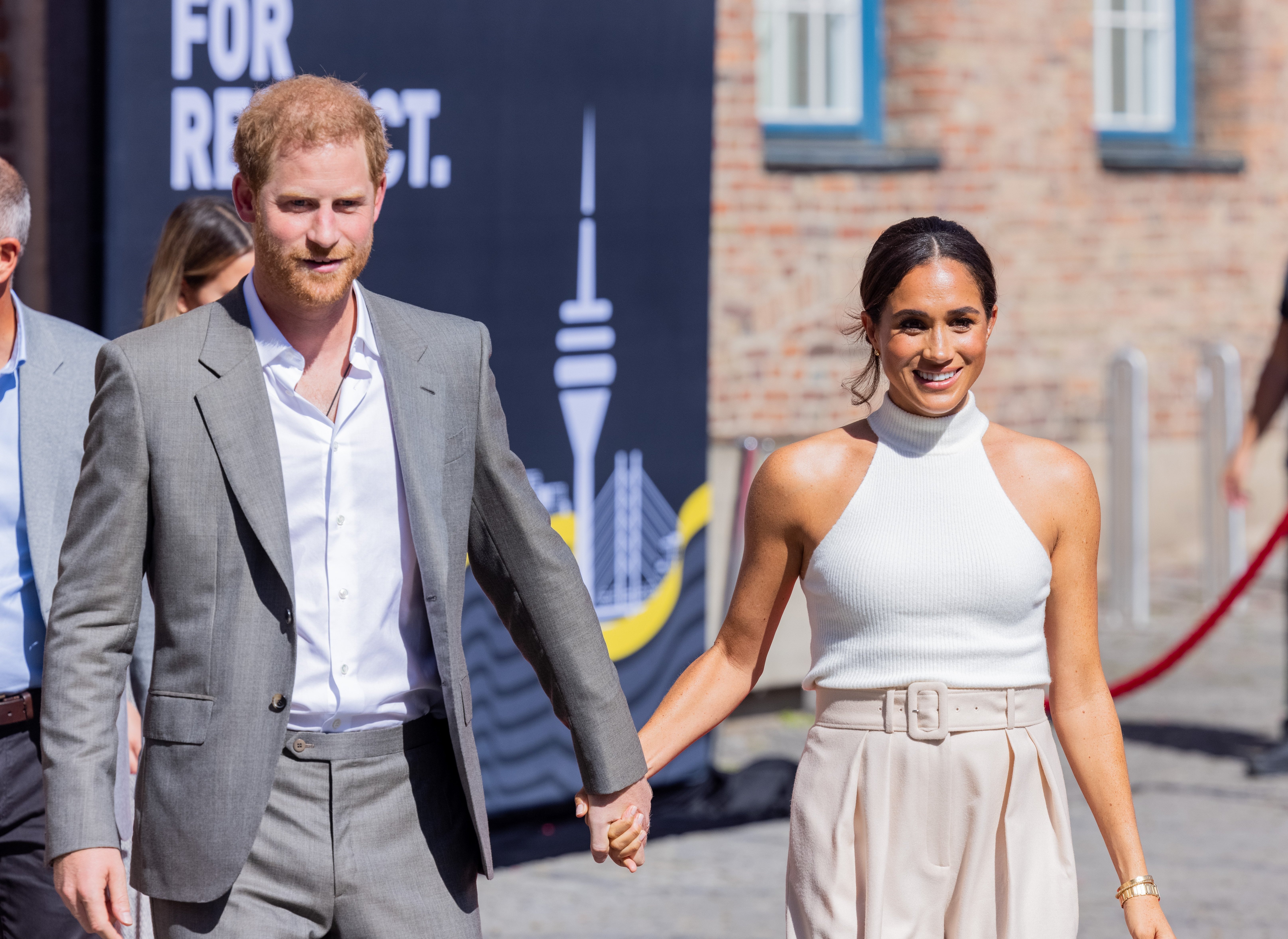 Britain's Prince Harry (l), Duke of Sussex, and his wife Meghan (r), Duchess of Sussex, arrive from City Hall | Source: Getty Images