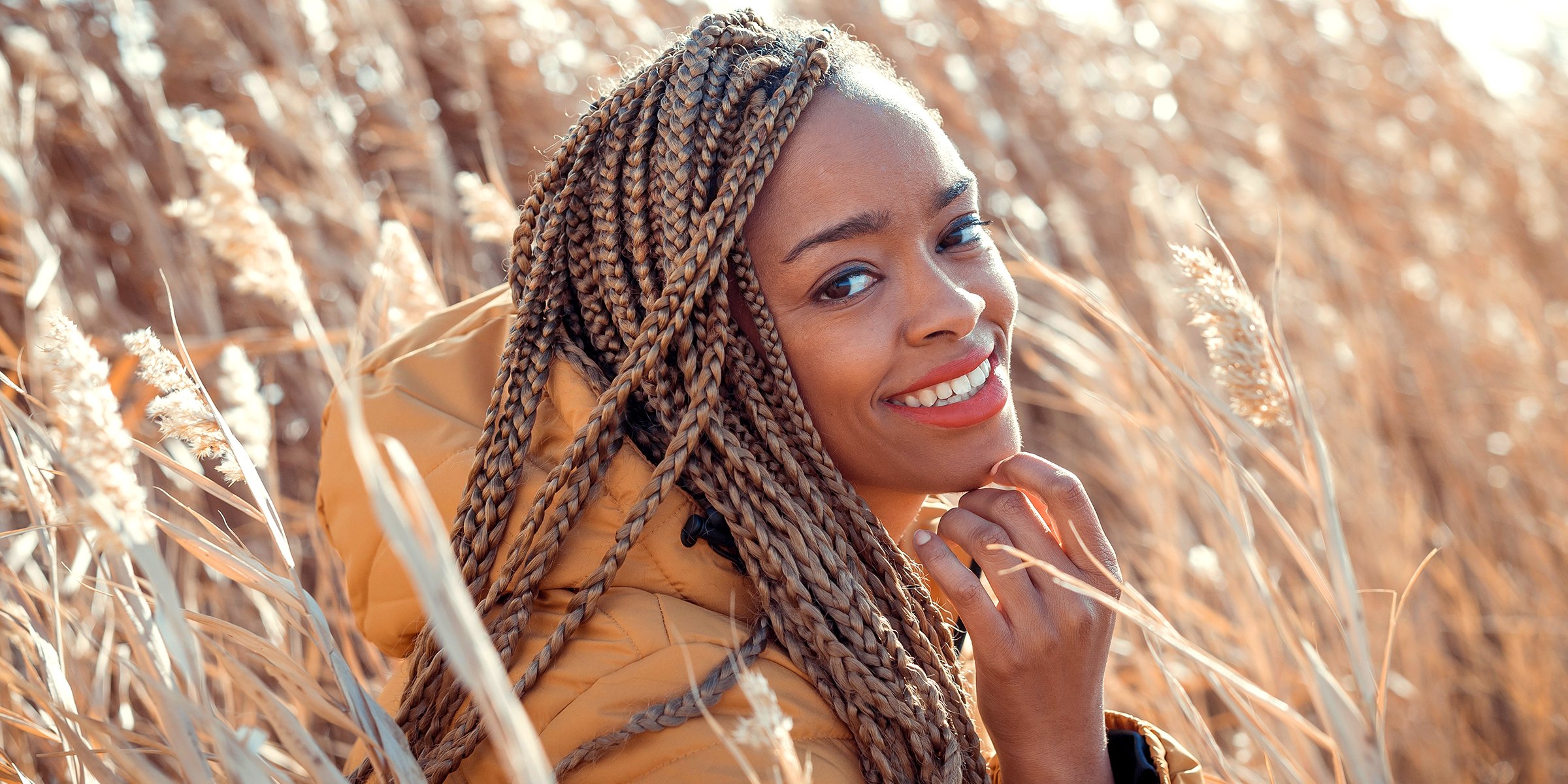 Woman with small box braids | Source: Shutterstock