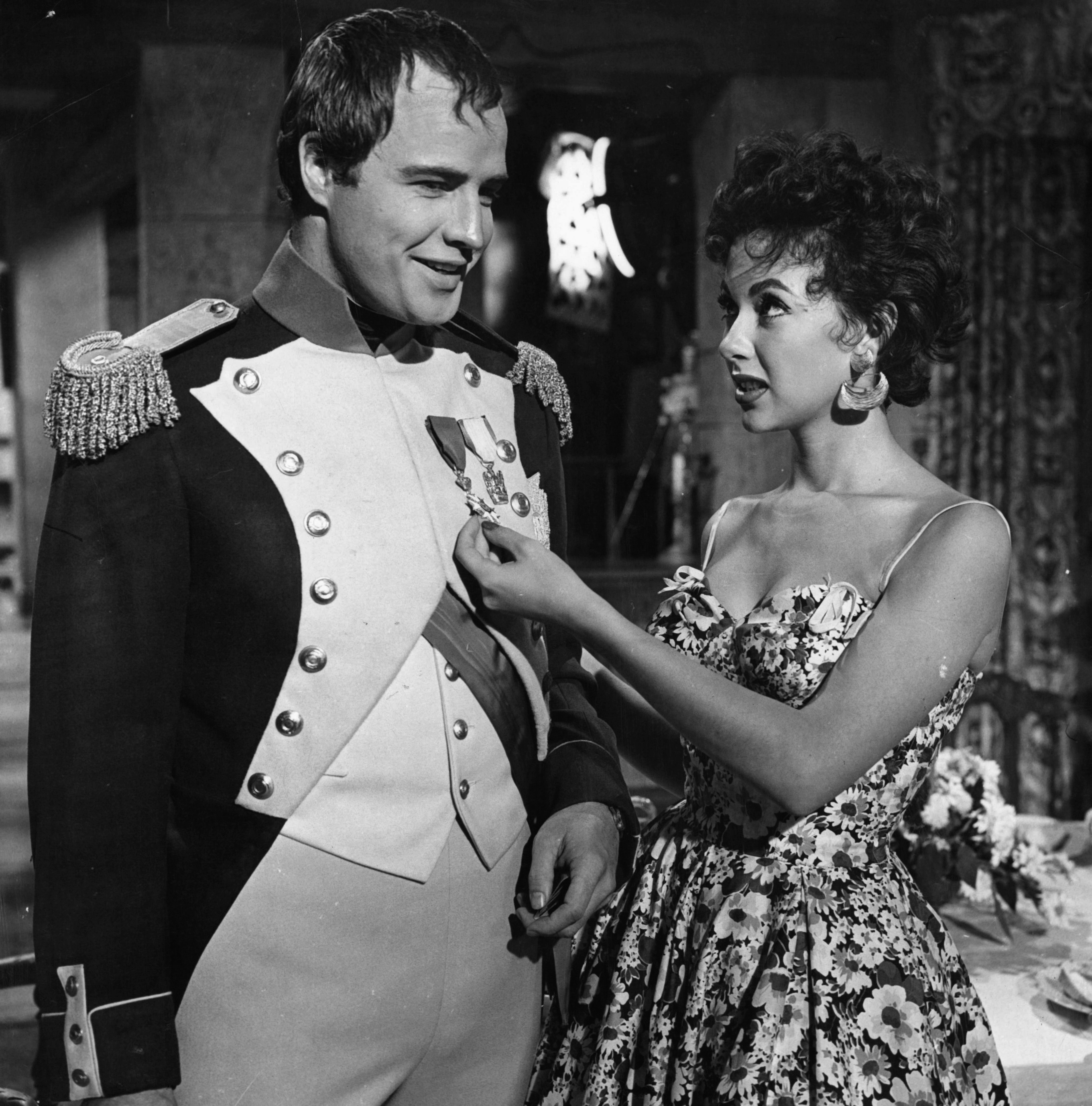 Marlon Brando and Rita Moreno visit on the set of the film 'Desiree', 1954. | Source: Getty Images