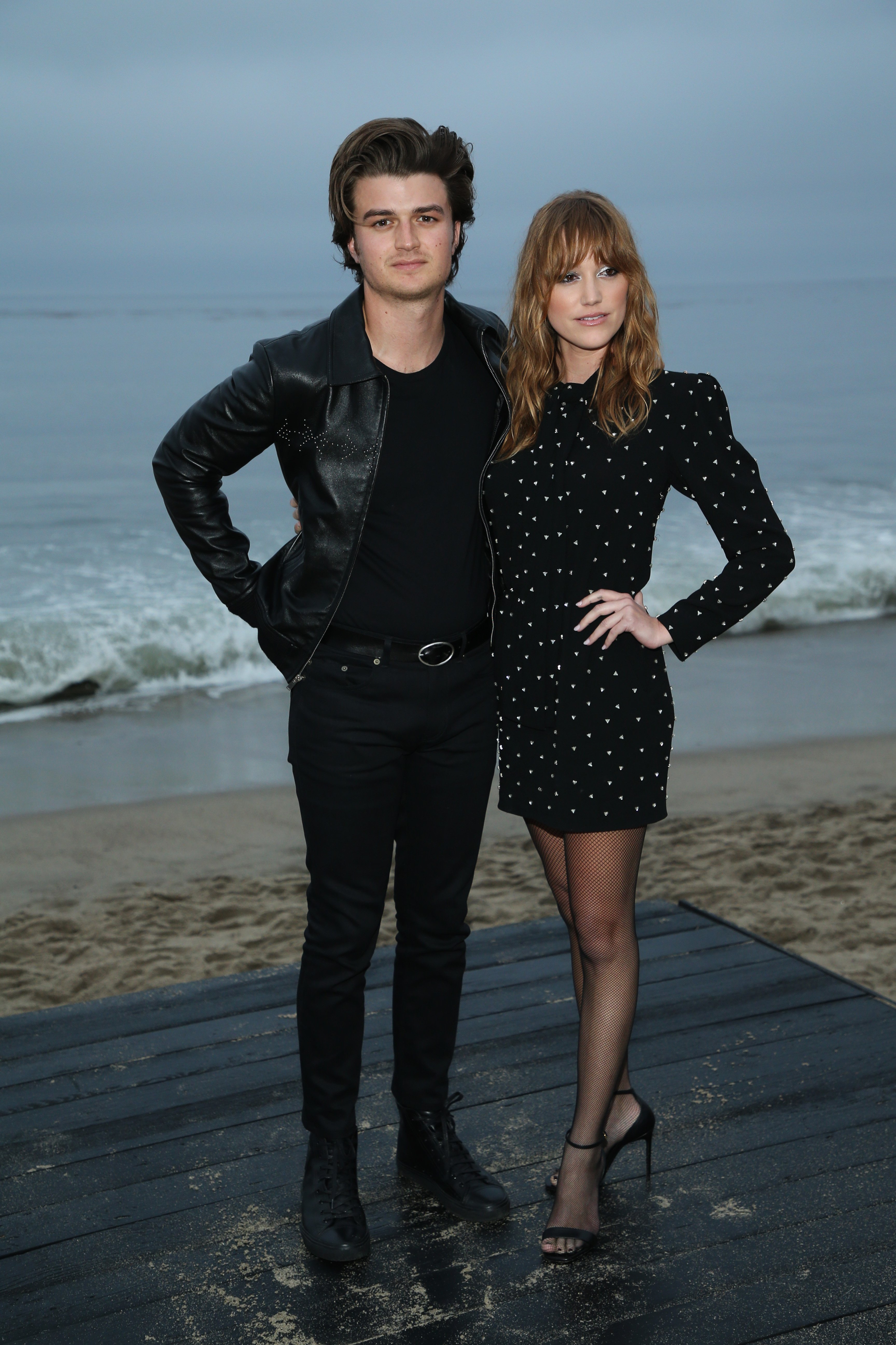 Joe Keery and Maika Monroe attend the Saint Laurent Men's Spring Summer 20 Show on June 6, 2019, in Malibu, California. | Source: Getty Images
