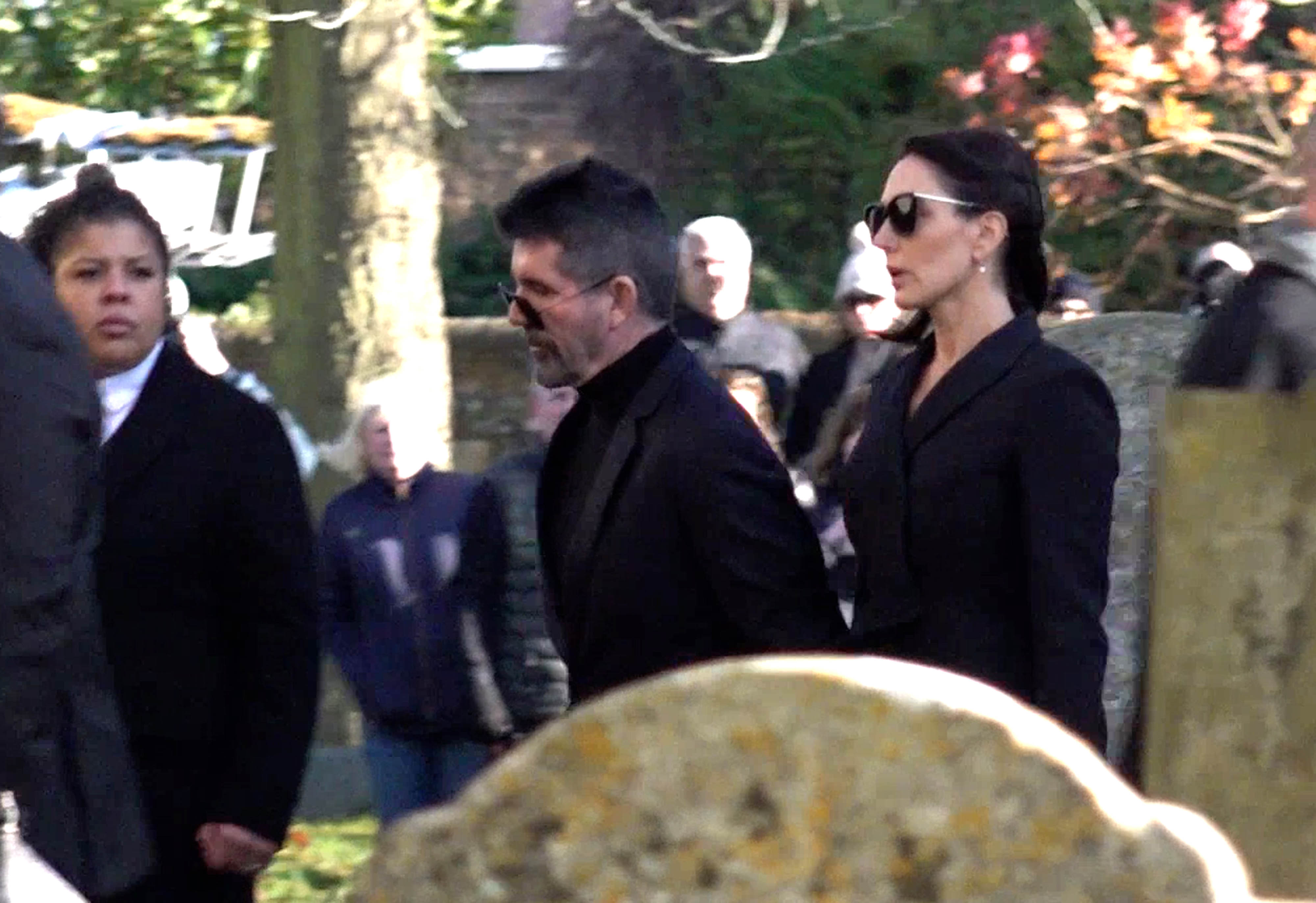 Cowell arrives in solemn black in November 2024, joined by fiancée Lauren Silverman for the funeral of Liam Payne. At St Mary's Church in Amersham, he stands in quiet reflection, mourning the loss of one of pop's brightest voices.