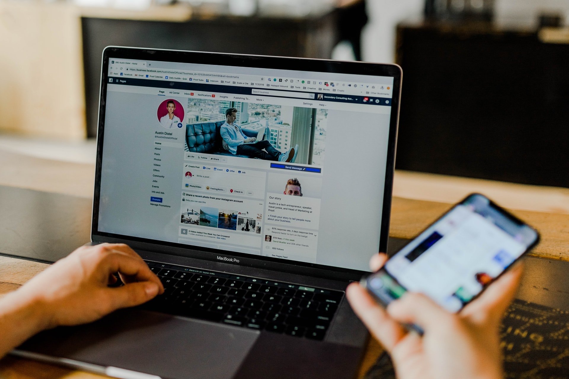 A person browsing social media and using their phone simultaneously | Source: Unsplash