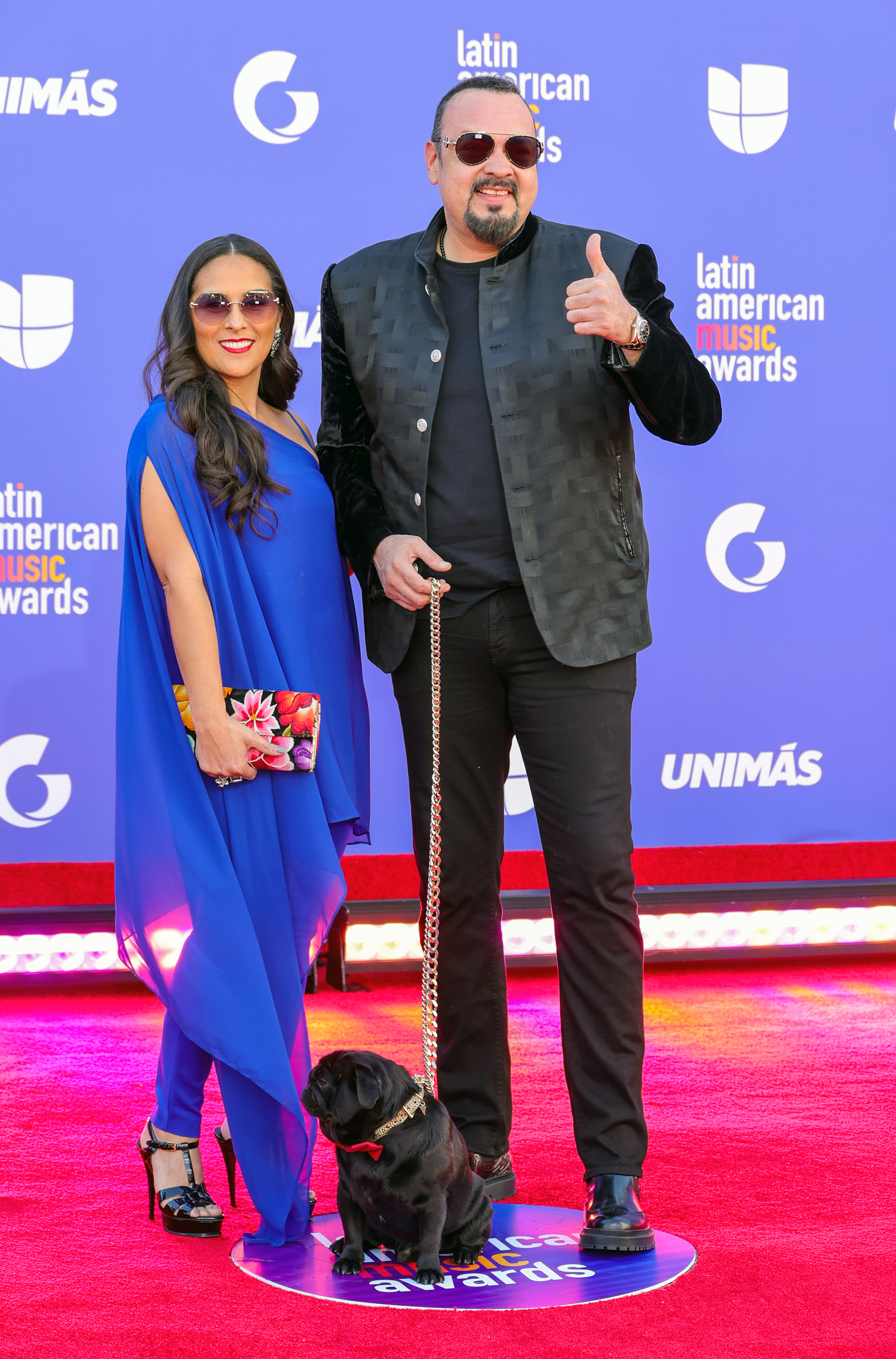 Aneliz Álvarez Alcalá and Pepe Aguilar attend the 2023 Latin American Music Awards with their dog, Gordo, at MGM Grand Garden Arena on April 20, 2023, in Las Vegas, Nevada. | Source: Getty Images