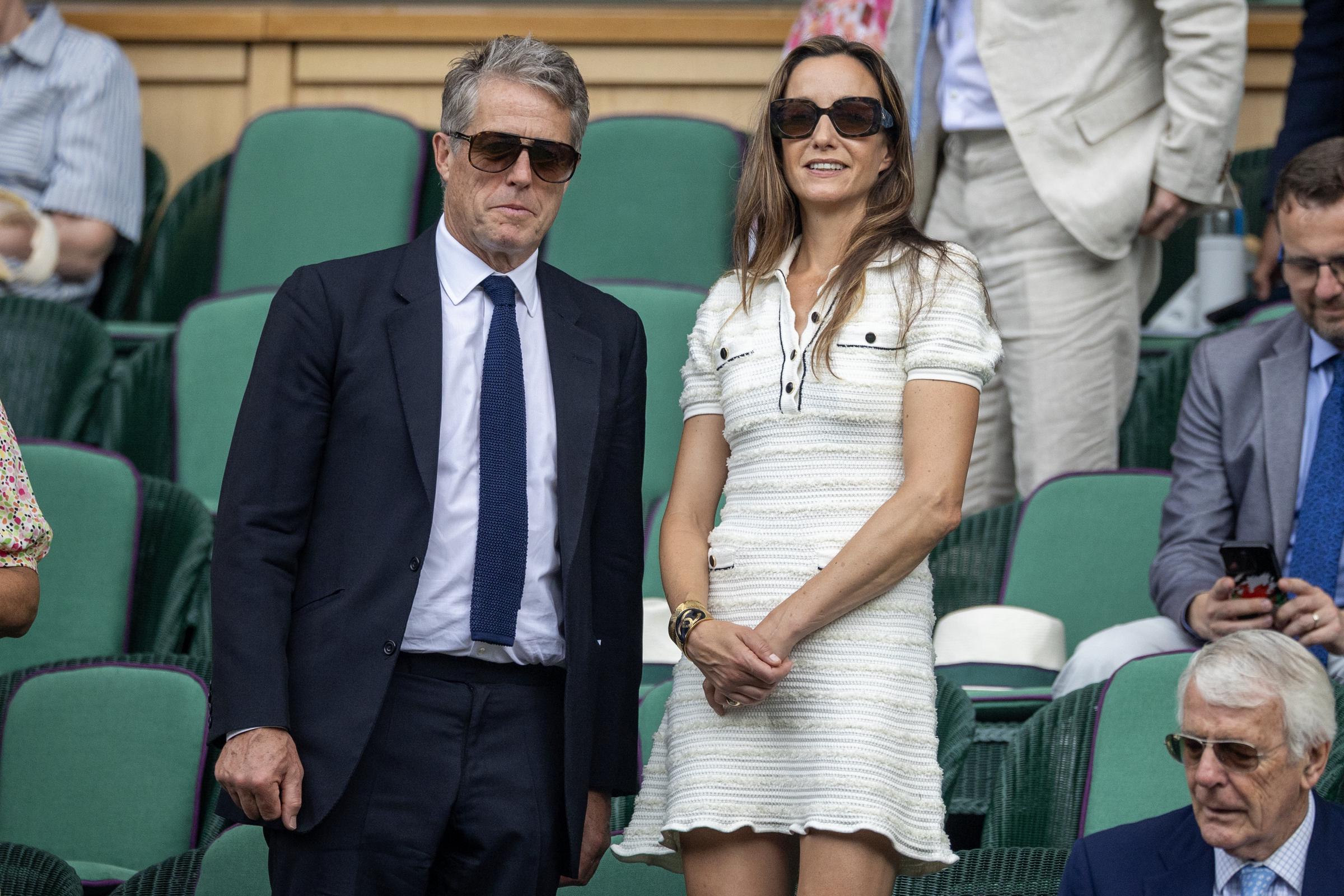 Hugh Grant and Anne Grant in the Royal Box on Centre Court during the Wimbledon Lawn Tennis Championships at the All England Lawn Tennis and Croquet Club on July 9, 2025, in London, England | Source: Getty Images