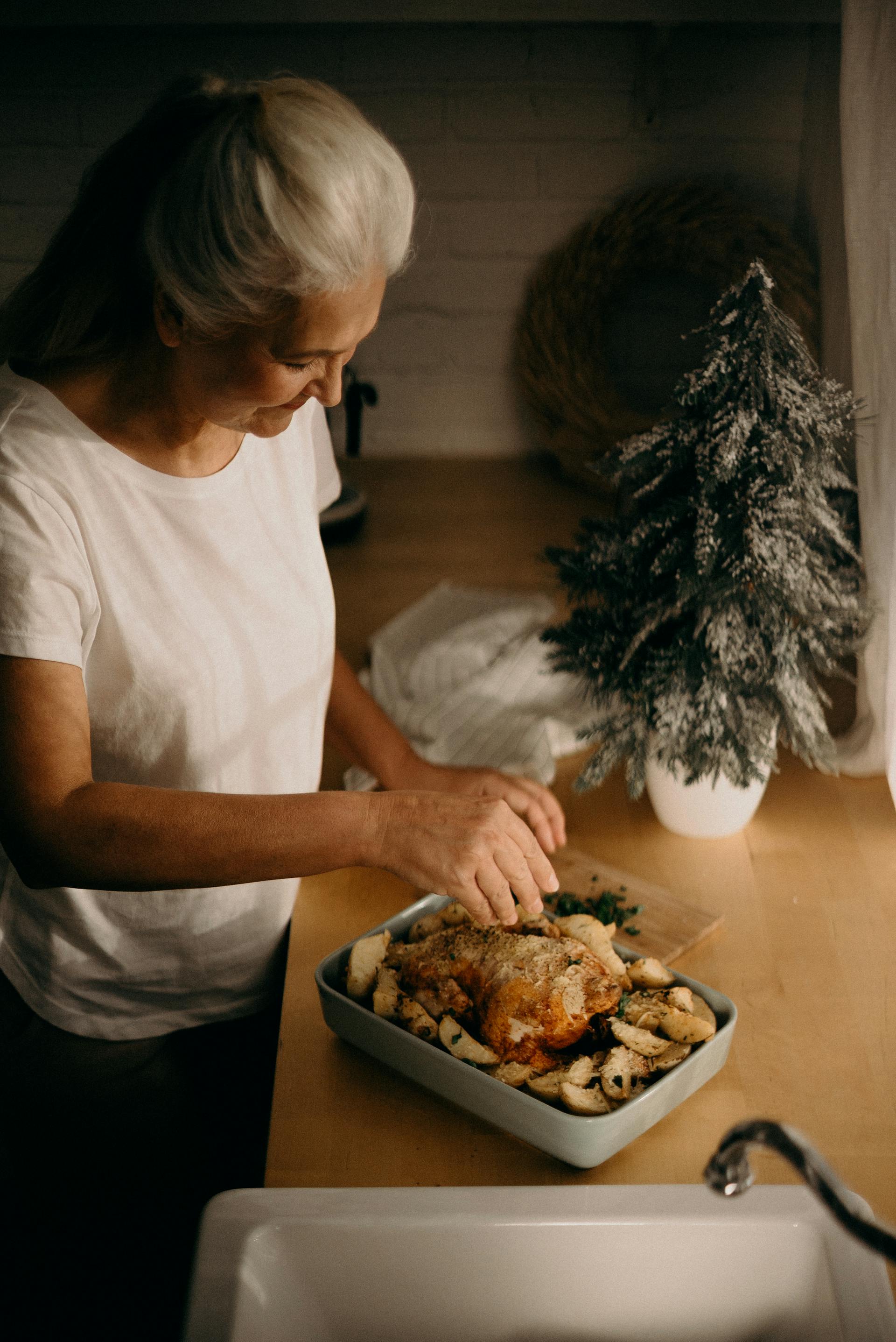 A senior woman preparing dinner | Source: Pexels