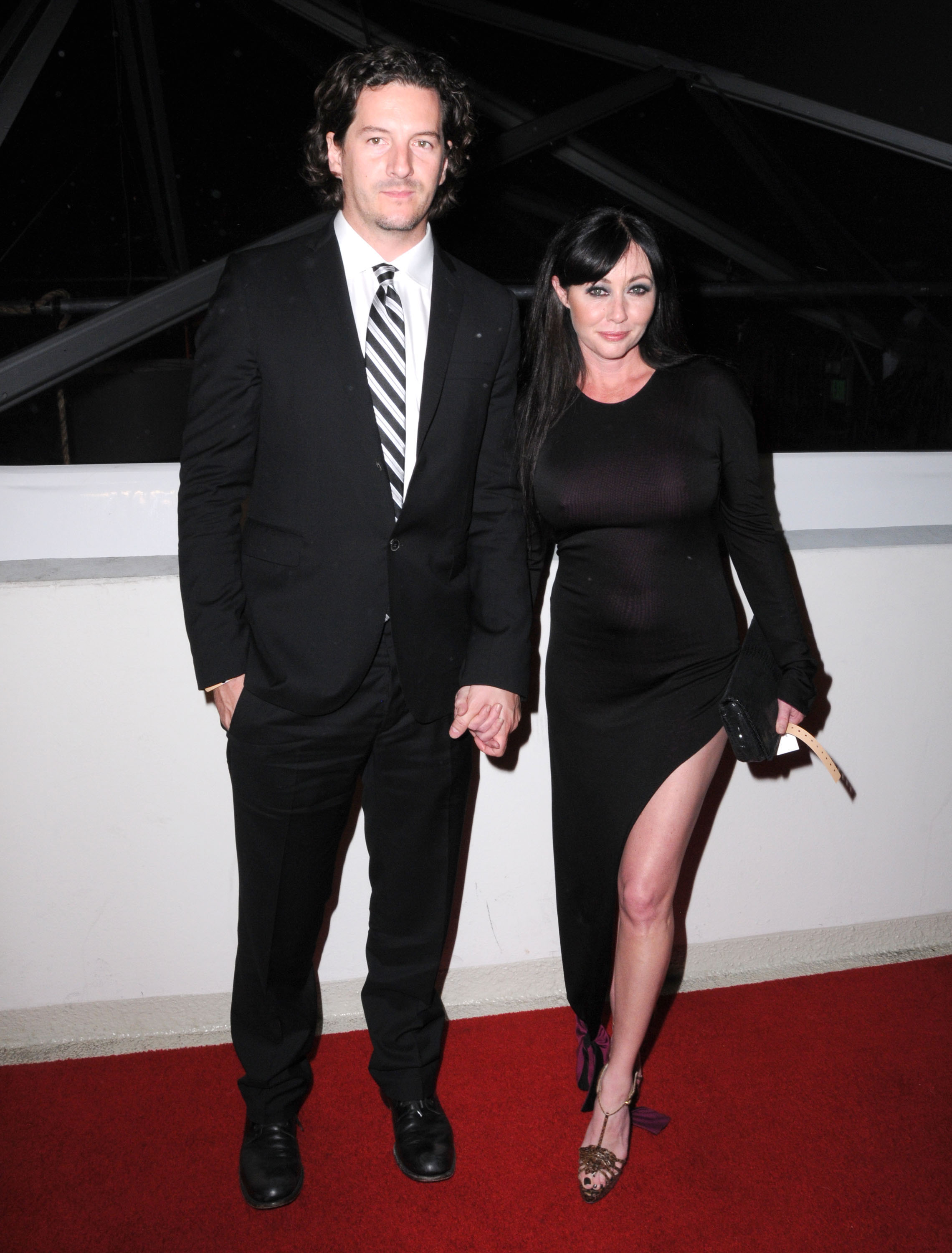 Kurt Iswarienko and Shannen Doherty arrive at The Weinstein Company and Realativity Media's Golden Globes after party held at Bar 210 inside The Beverly Hilton hotel in Beverly Hills, California on January 16, 2011. | Source: Getty Images