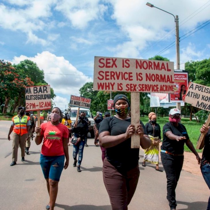 Members of the Female Sex Workers Association in Malawi participate in a march in Lilongwe, on January 28, 2021, to demonstrate against governments COVID-19 preventive measures put in place by Malawi President Lazarus Chakwera; among them the reduced time when bars are to be open. - The sex workers argue that the instruction from government to bar owners that the bars be opened only from 2pm to 8pm will compromise the business of sex work which is done at night when most clients are free from their everyday business activities. (Photo by AMOS GUMULIRA / AFP) (Photo by AMOS GUMULIRA/AFP via Getty Images)