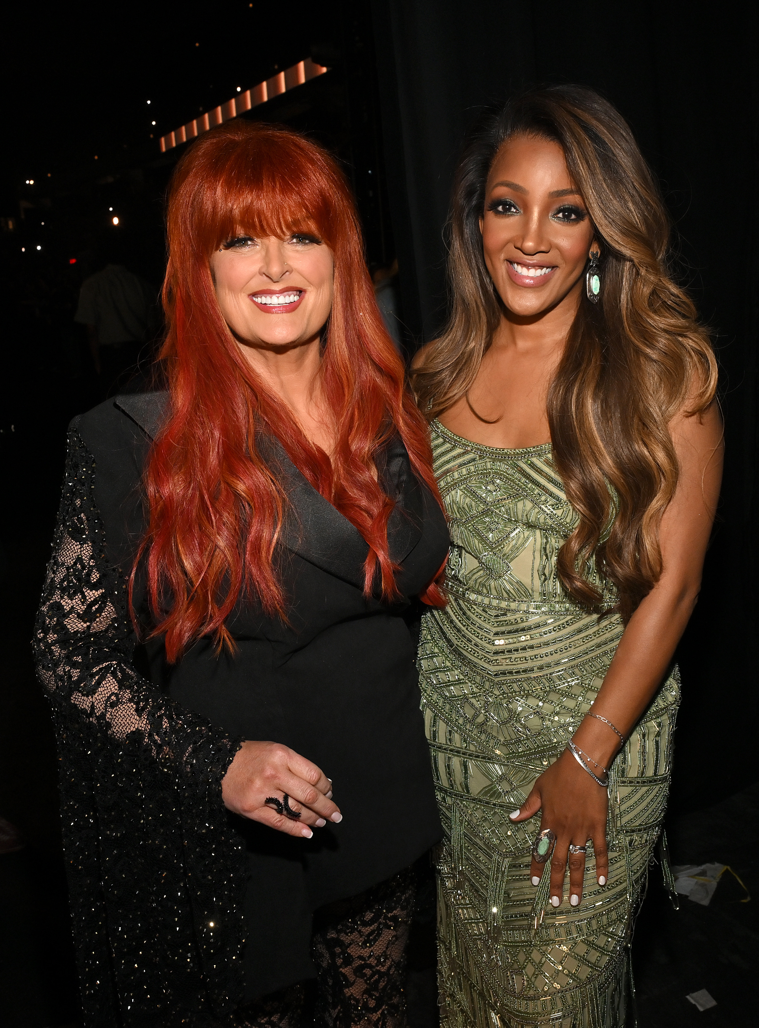 Wynonna Judd poses with Mickey Guyton at the 60th ACM Awards in Frisco, Texas. The two artists shared a warm moment during the star-studded night, which featured performances, tributes, and surprises.