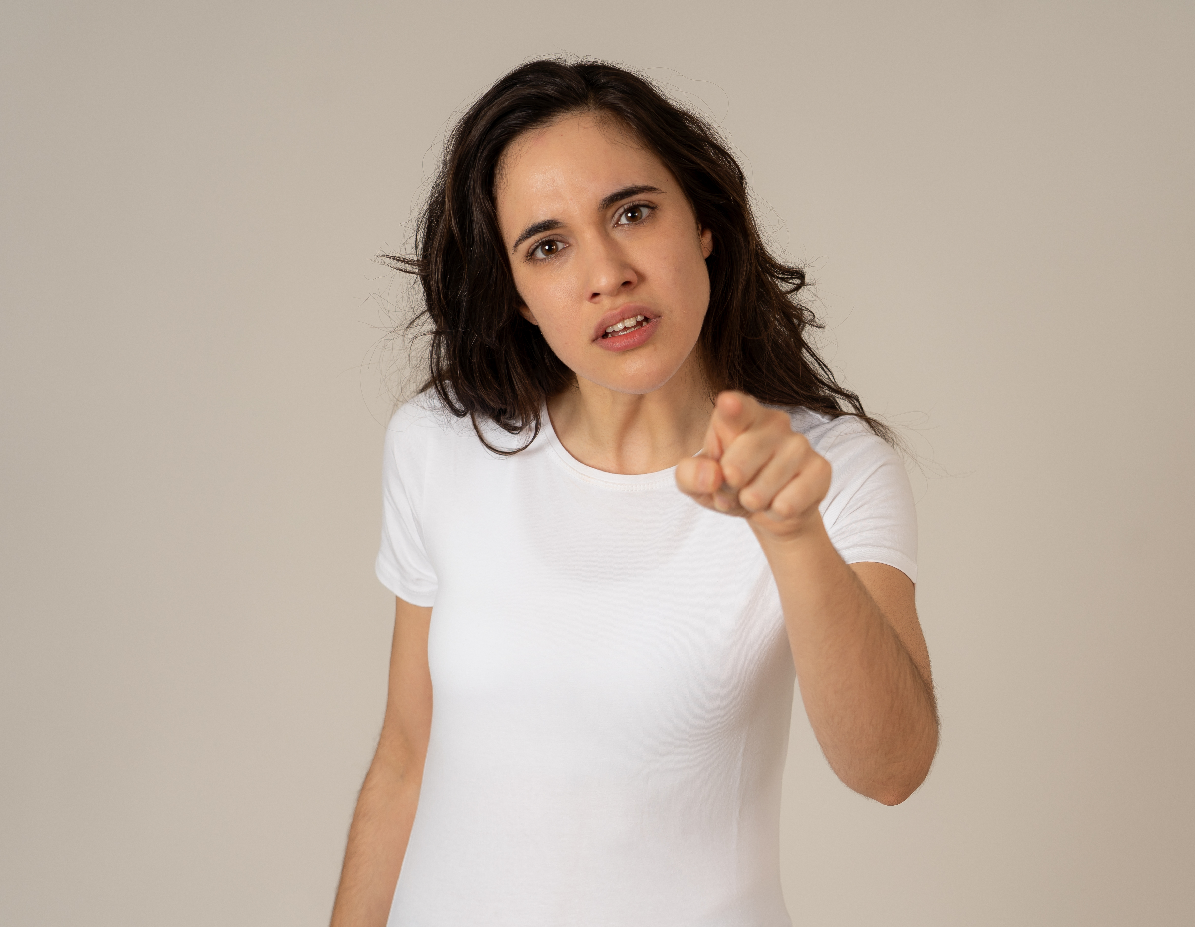 An angry woman pointing an accusatory finger | Source: Shutterstock