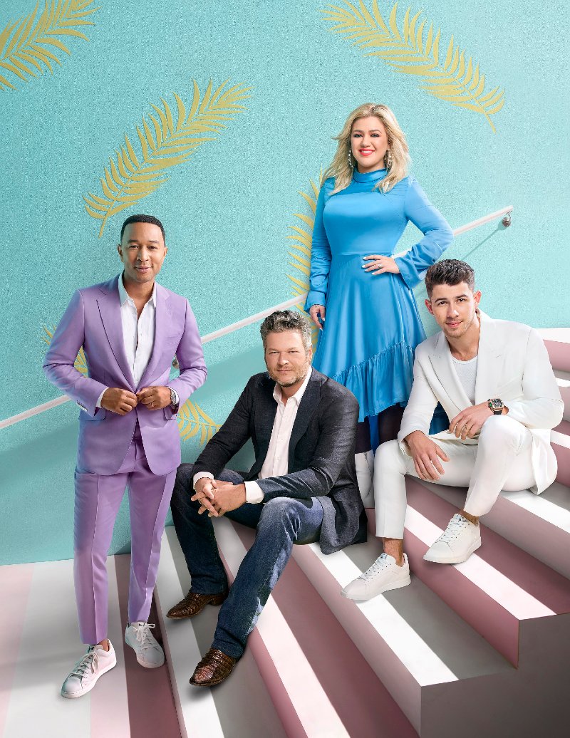 John Legend, Blake Shelton, Kelly Clarkson, and Nick Jonas posing for a promotional photo for “The Voice” season 18 in November 2019. | Image: Getty Images.