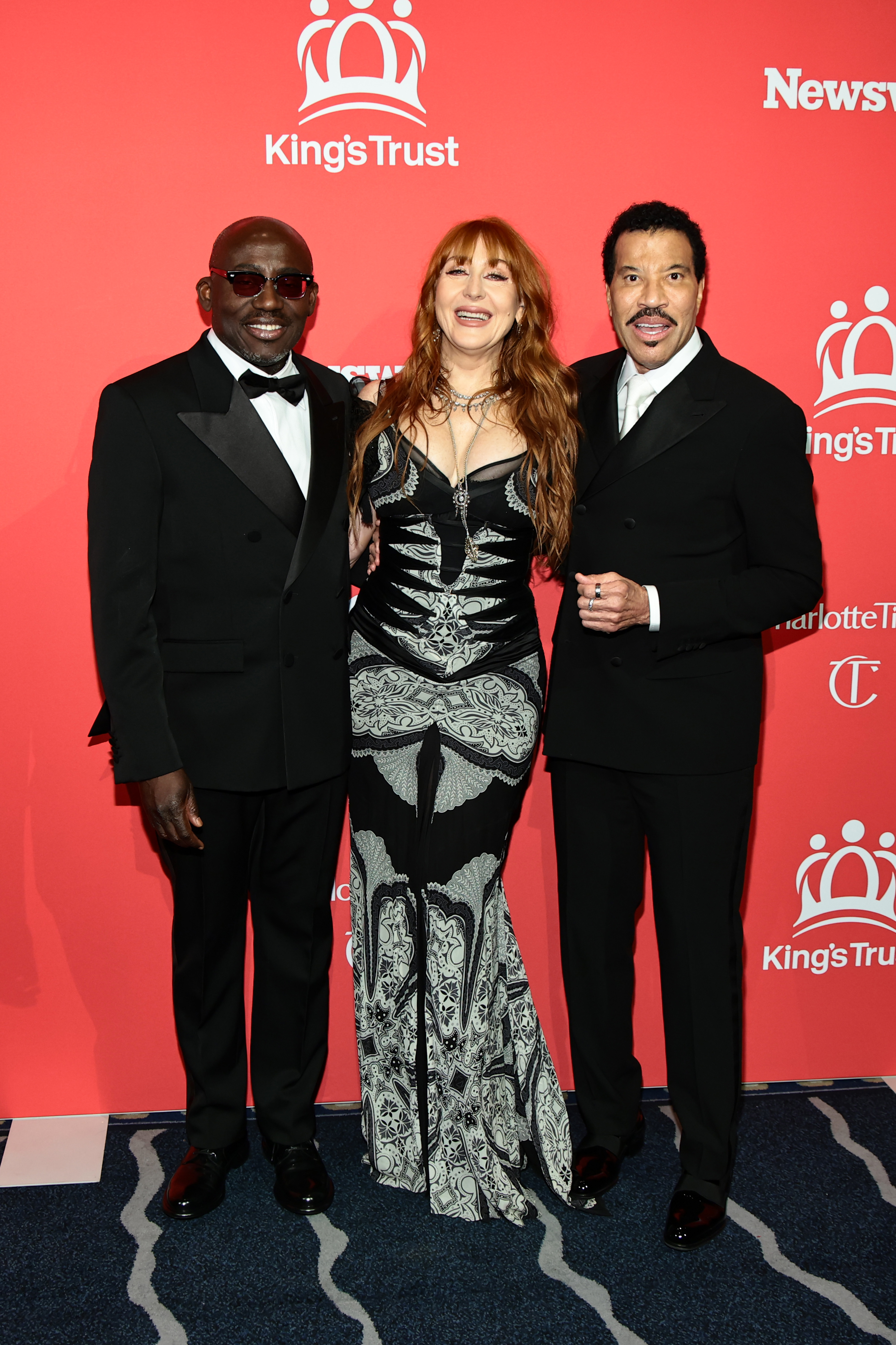 Edward Enninful and Charlotte Tilbury join Richie in a cheerful moment, all three sharing warm smiles that reflect the upbeat energy of the evening.