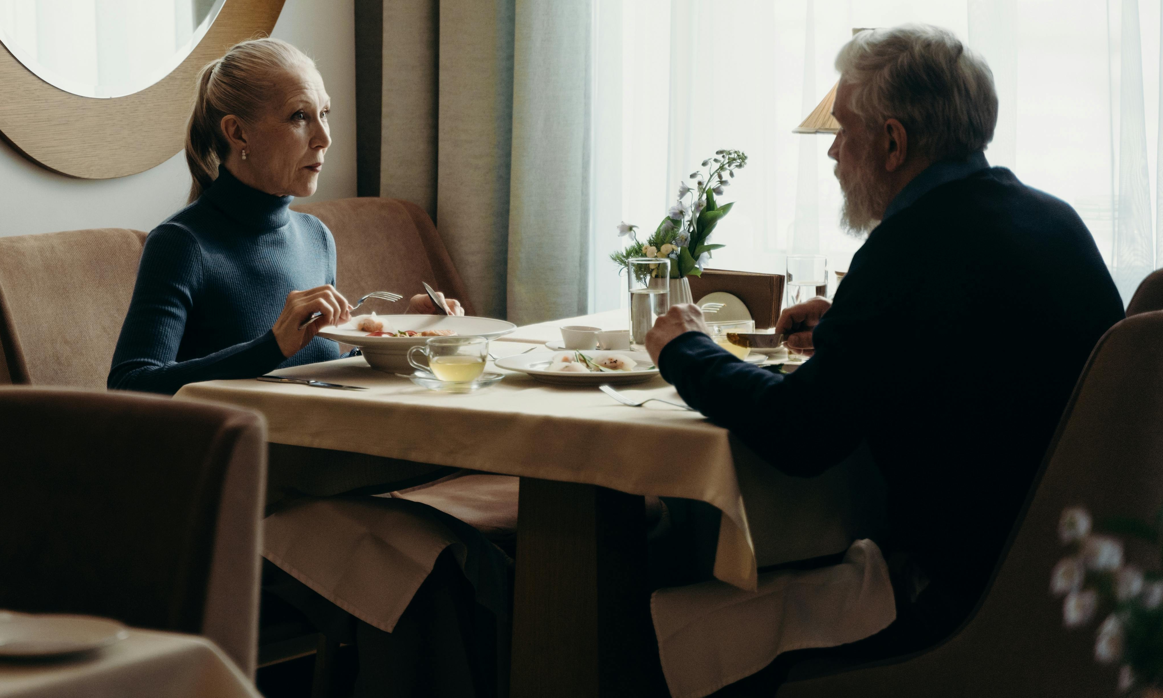 An elderly couple at a restaurant table | Source: Pexels