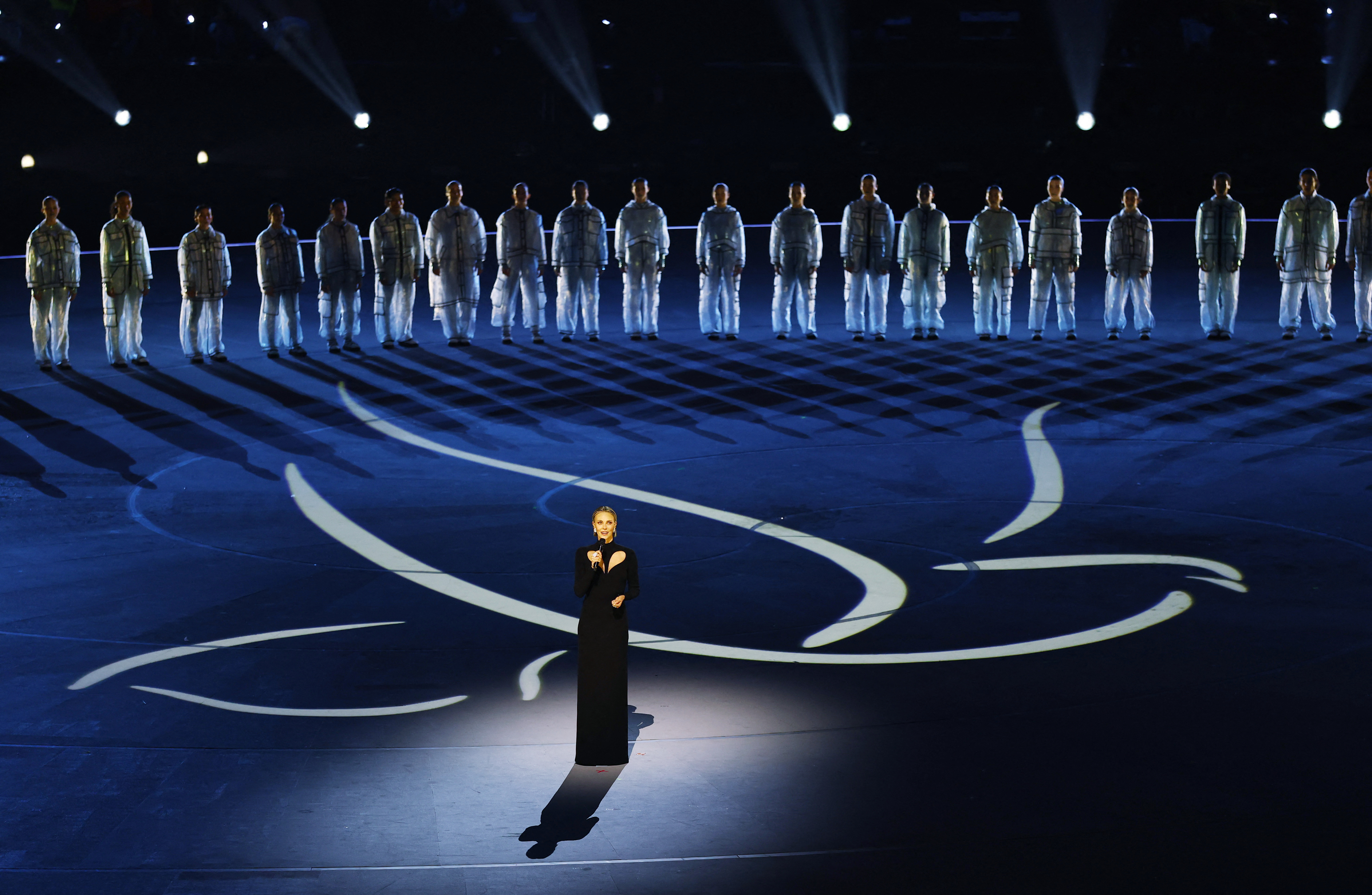 Charlize Theron delivers a speech during the opening ceremony of the Winter Olympic Games at the San Siro stadium on February 6, 2026, in Milan, Italy | Source: Getty Images