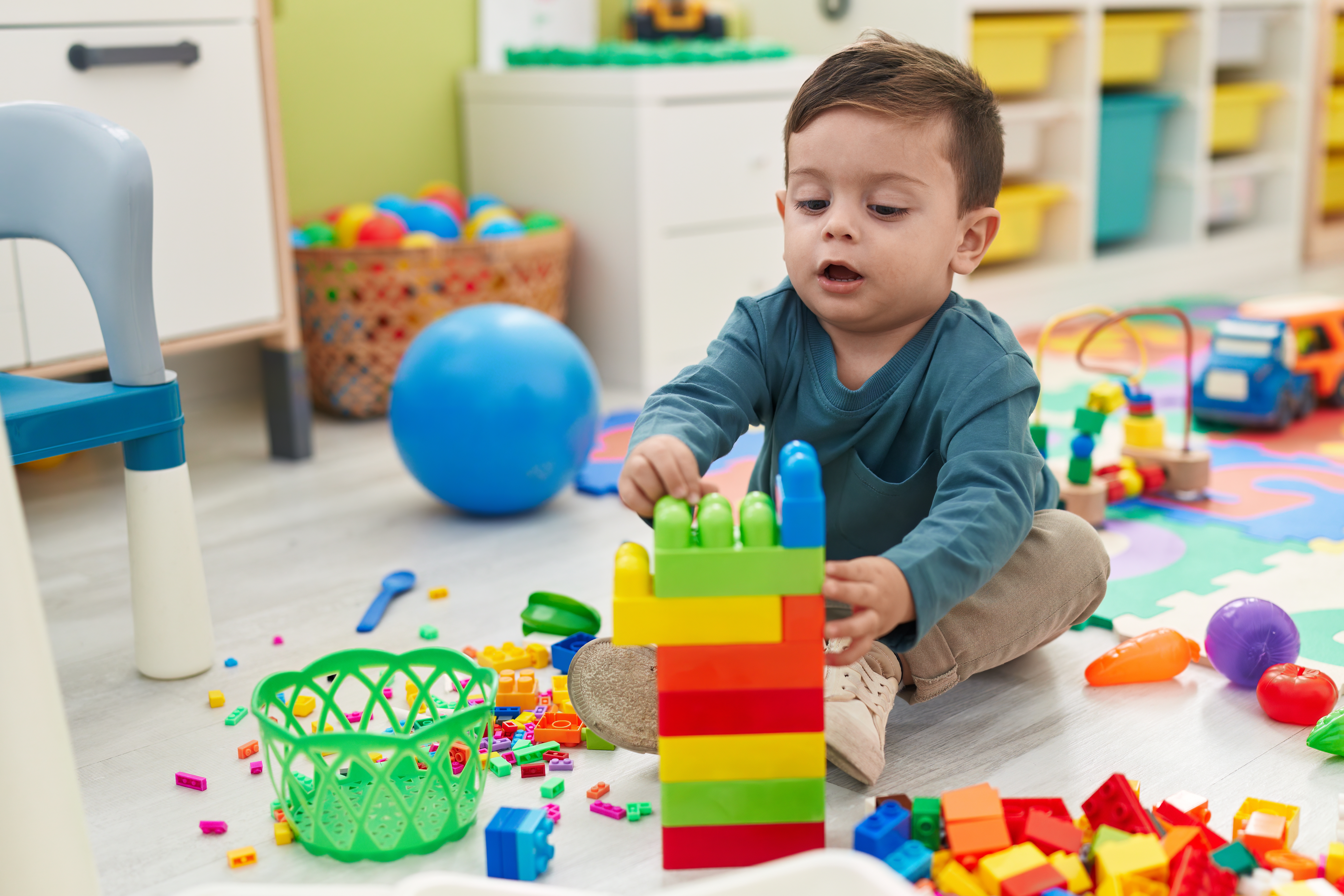 A child playing with toys | Source: Shutterstock