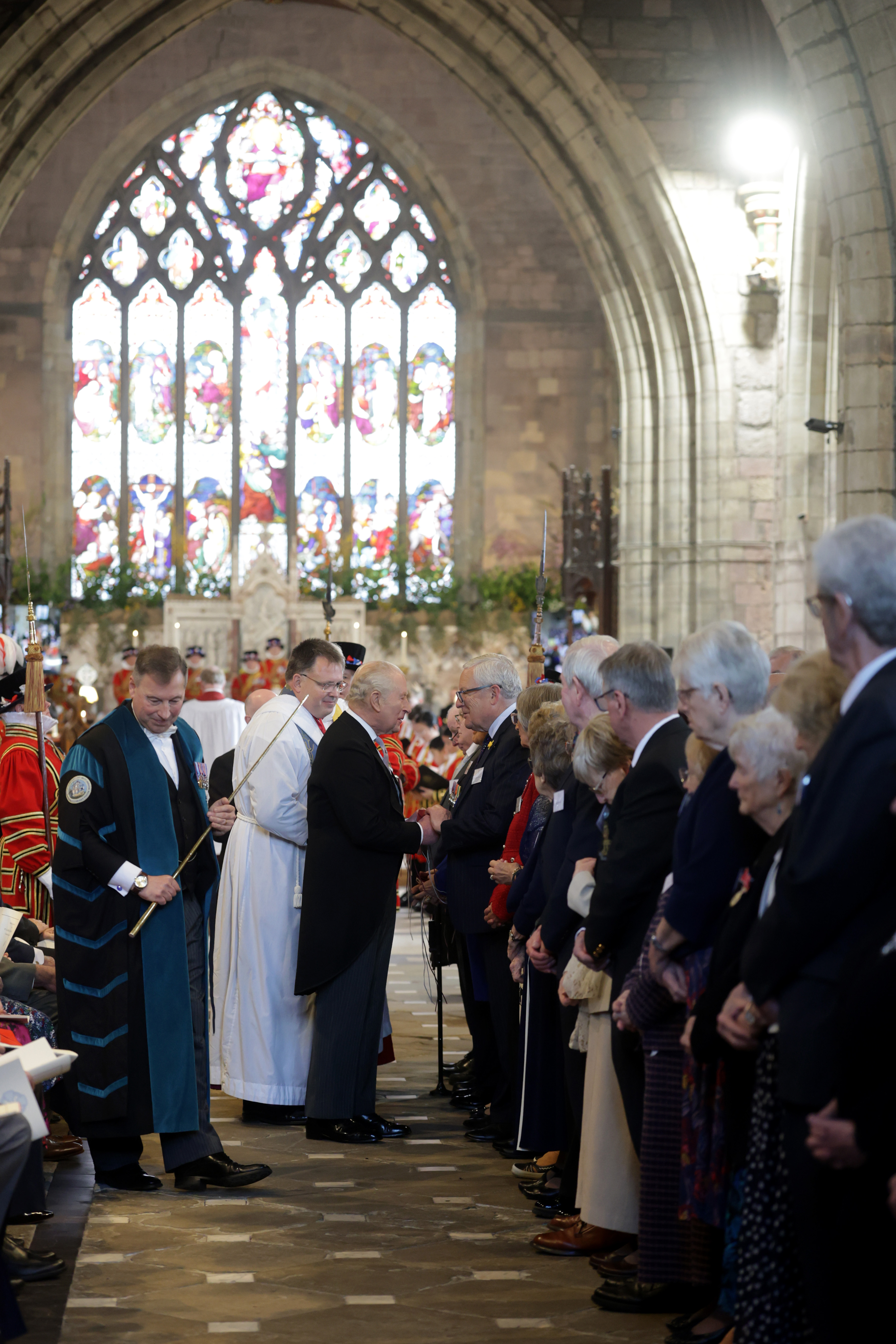 King Charles III meets with some of the 77 men and 77 women Maundy recipients at the Royal Maundy Service at St Asaph Cathedral on 2 April 2026 in St Asaph, Wales. | Source: Getty Images