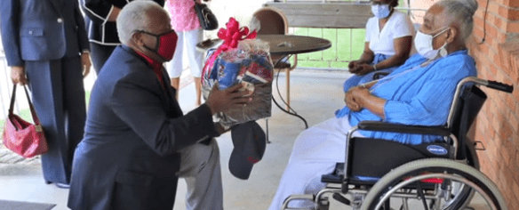 James Clark, President of South Carolina State University gifted Catherine Miller Morgan Harris merchandise for her 103 birthday. | Photo: Good Morning American 