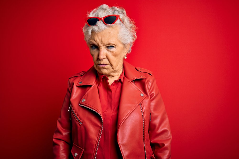 A photo of a senior woman frowning her face. | Photo: Shutterstock.