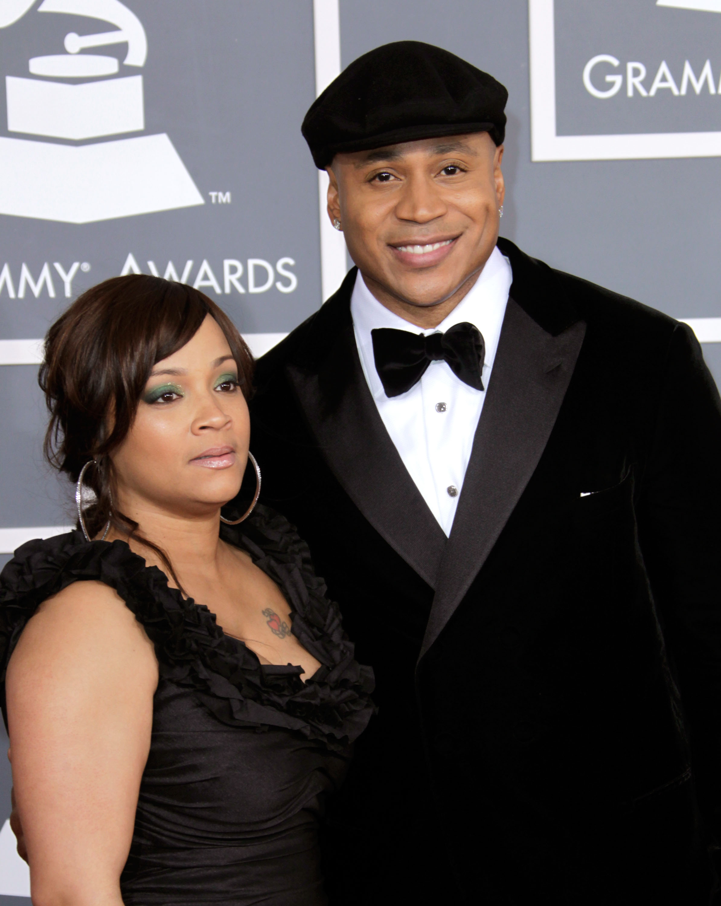 Simone Smith and LL Cool J arrive at the 54th Annual GRAMMY Awards on February 12, 2012 | Source: Getty Images