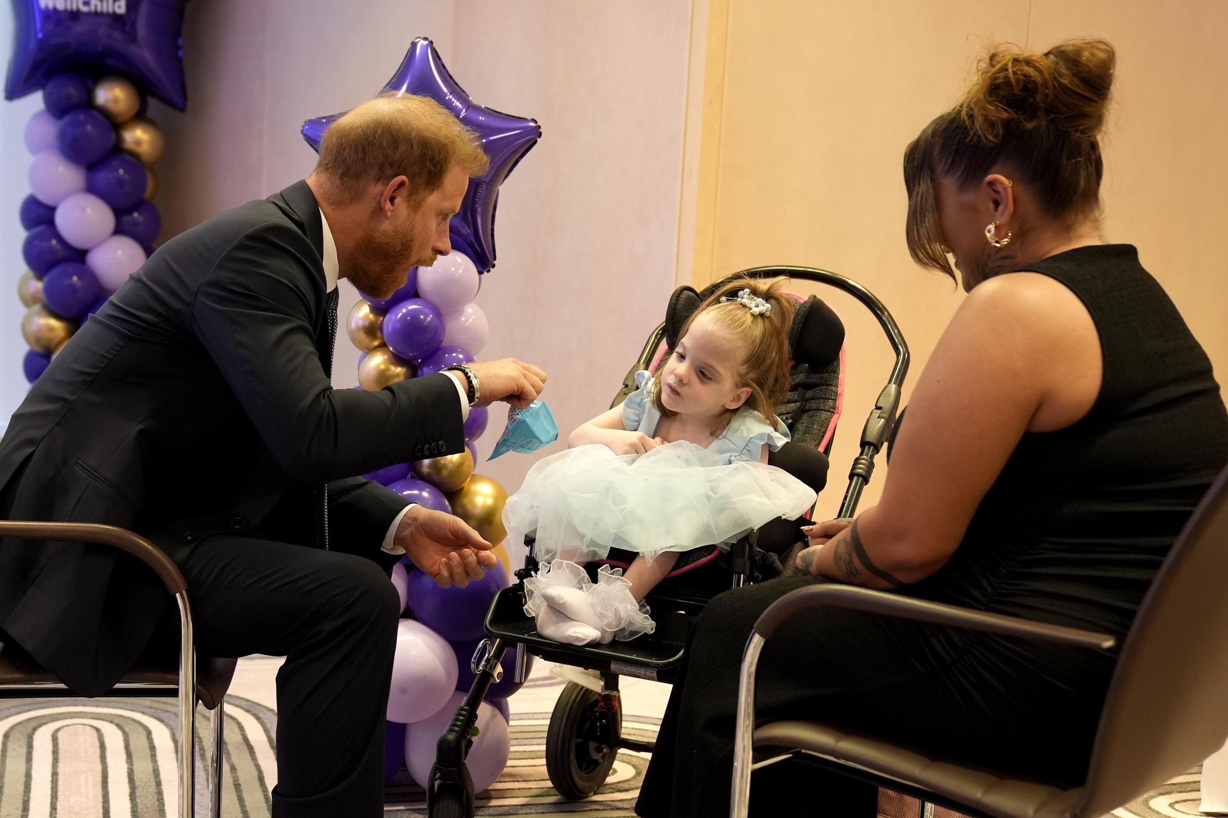 Prince Harry, Duke of Sussex speaks with six-year-old Esmee Mcglinchey (centre) at the annual WellChild Awards 2025 in England on September 8 | Source: Getty Images