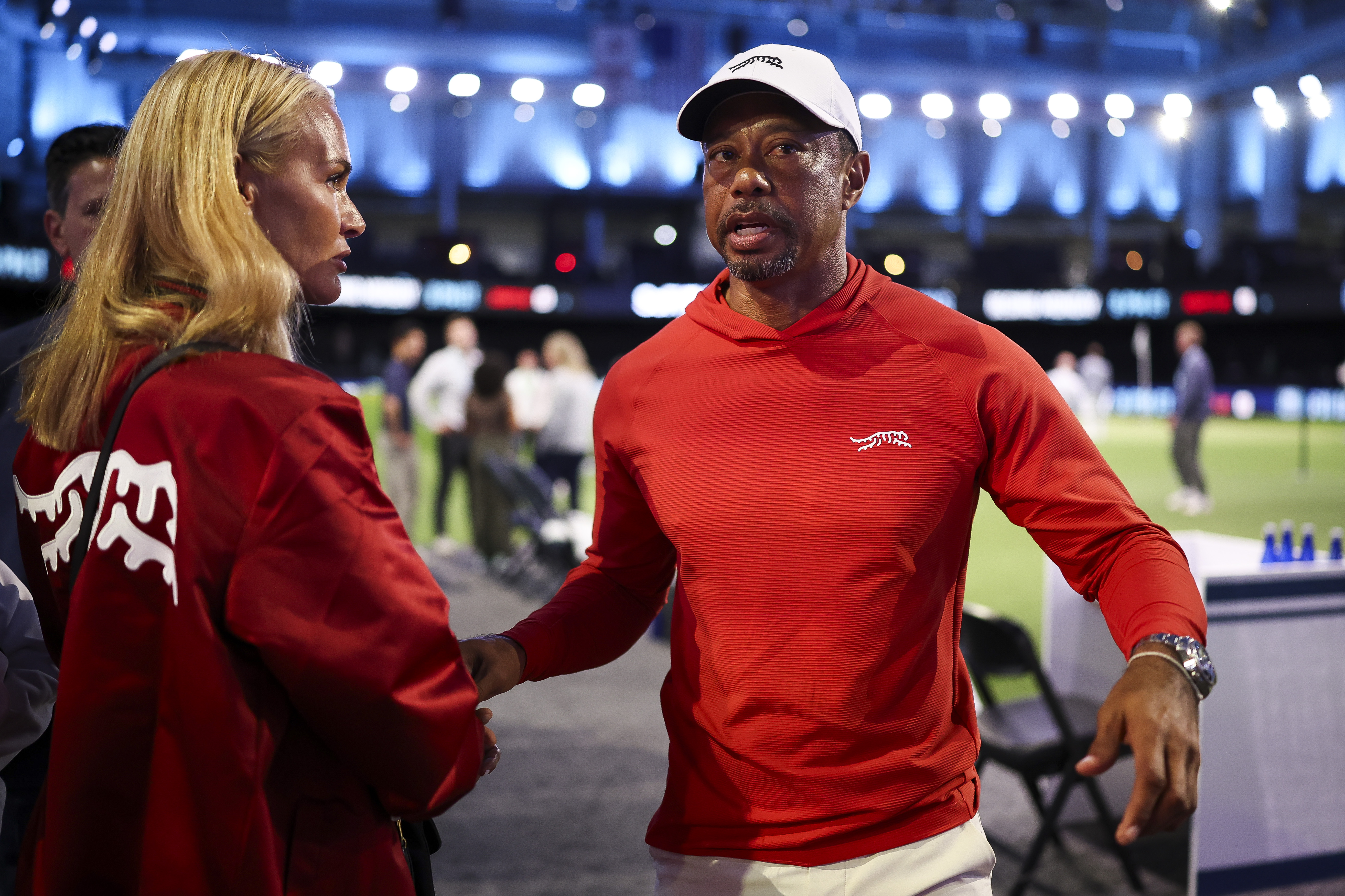 Tiger Woods of Jupiter Links GC talks with his girlfriend, Vanessa Trump, after a match against Boston Common Golf at SoFi Center on March 17, 2026 in Palm Beach Gardens, Florida | Source: Getty Images