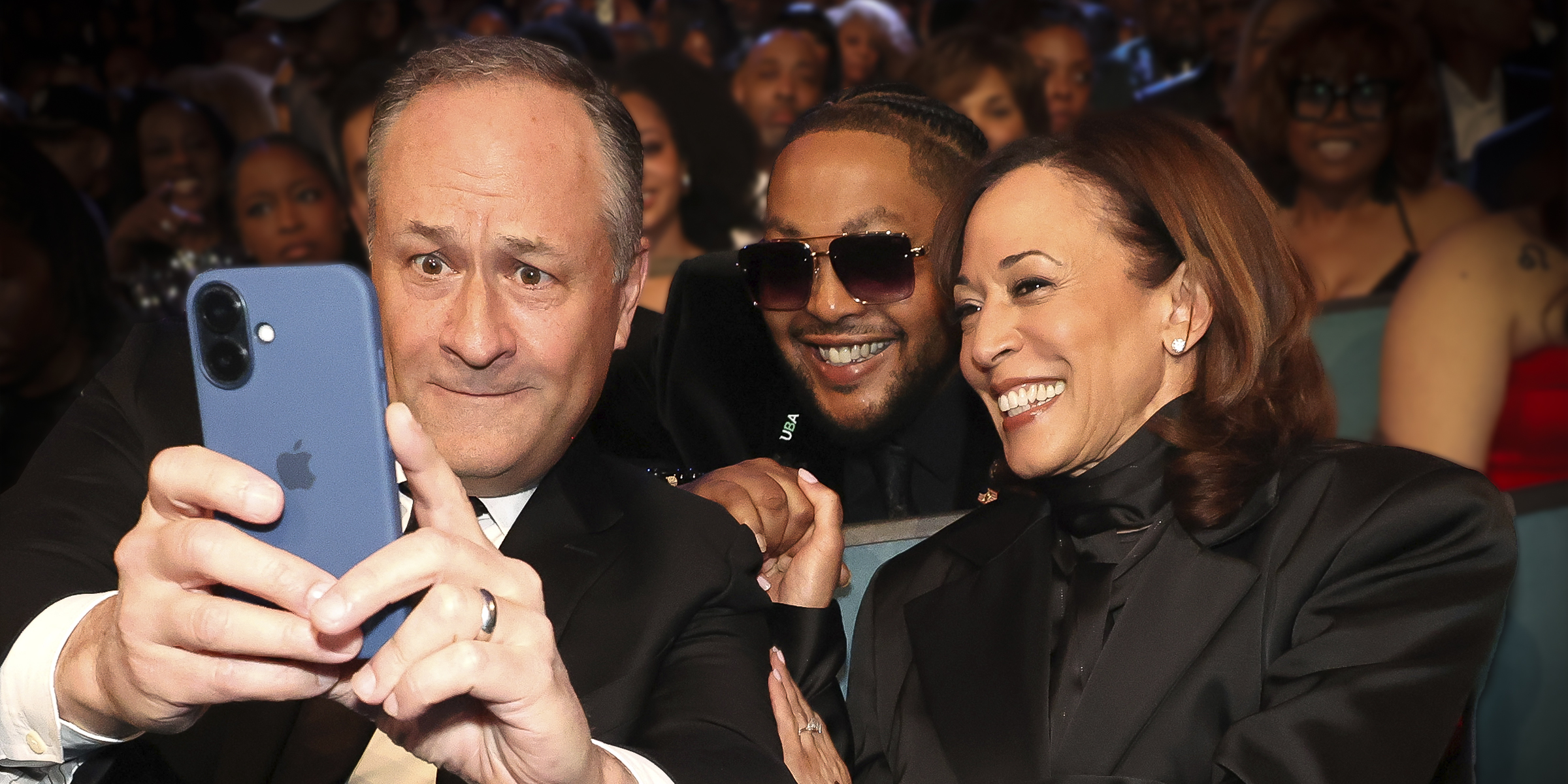 Douglas Emhoff and Kamala Harris posing for a picture with someone. | Source: Getty Images